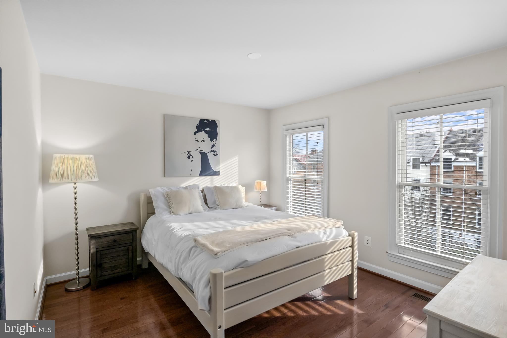 419 Princess Street Alexandria, VA 22314 - Photo 30 of 44 a bedroom with a bed and wooden floor