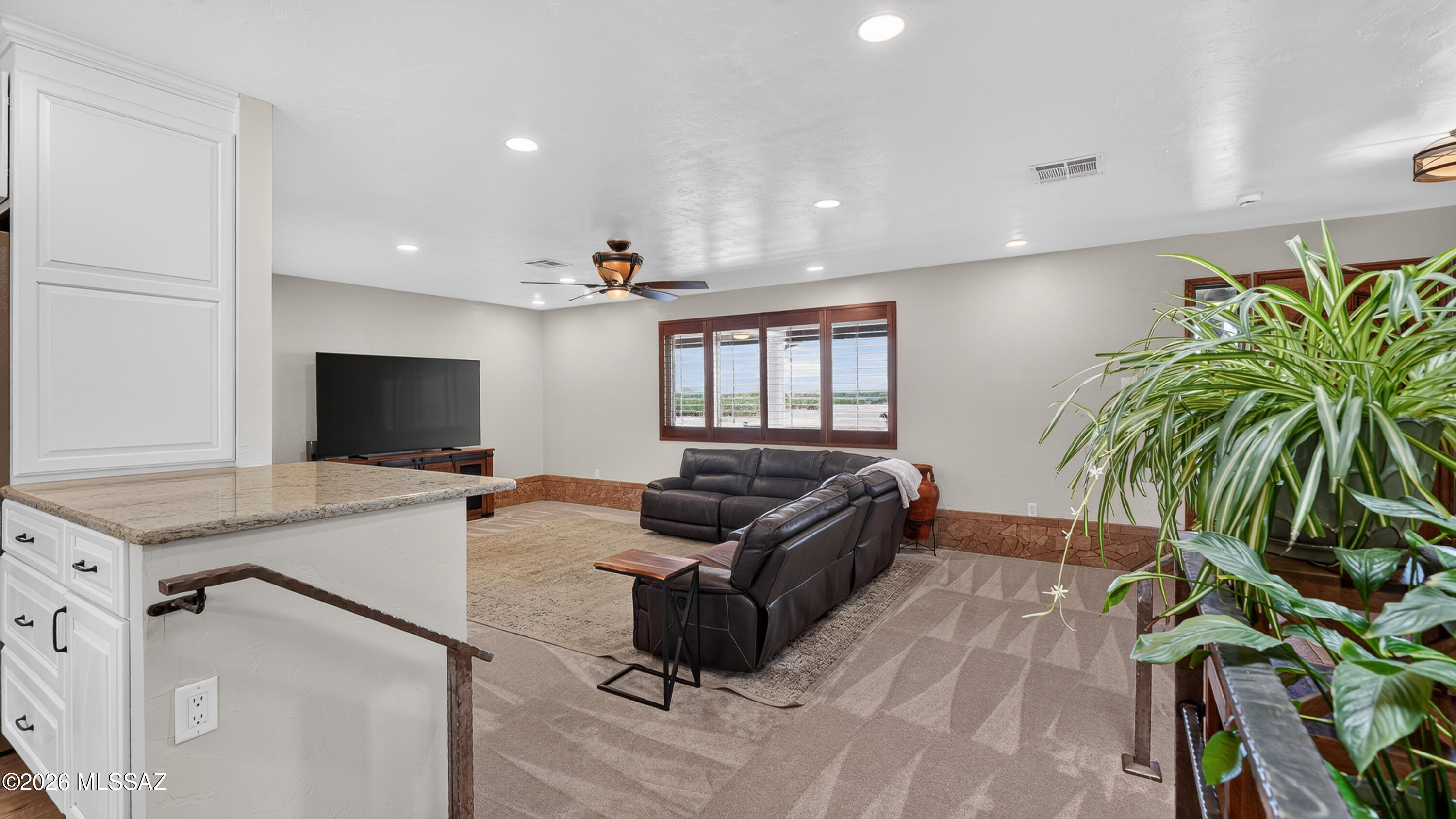 194 Taylor Road Willcox, AZ 85643 - Photo 14 of 54 Living room - 9' Ceilings, Brand New Carpet, Built in Bookshelves, Can lighting and Custom Wooden Window Shutters