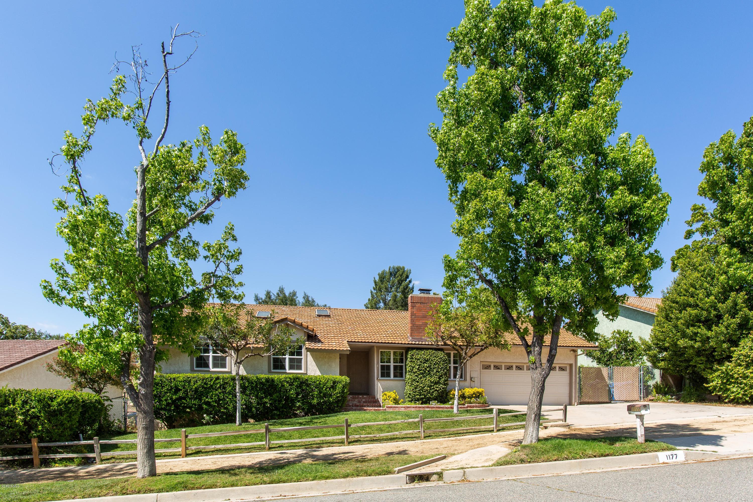 1177 Rambling Road Simi Valley, CA 93065 - Photo 1 of 56 a front view of a house with a yard