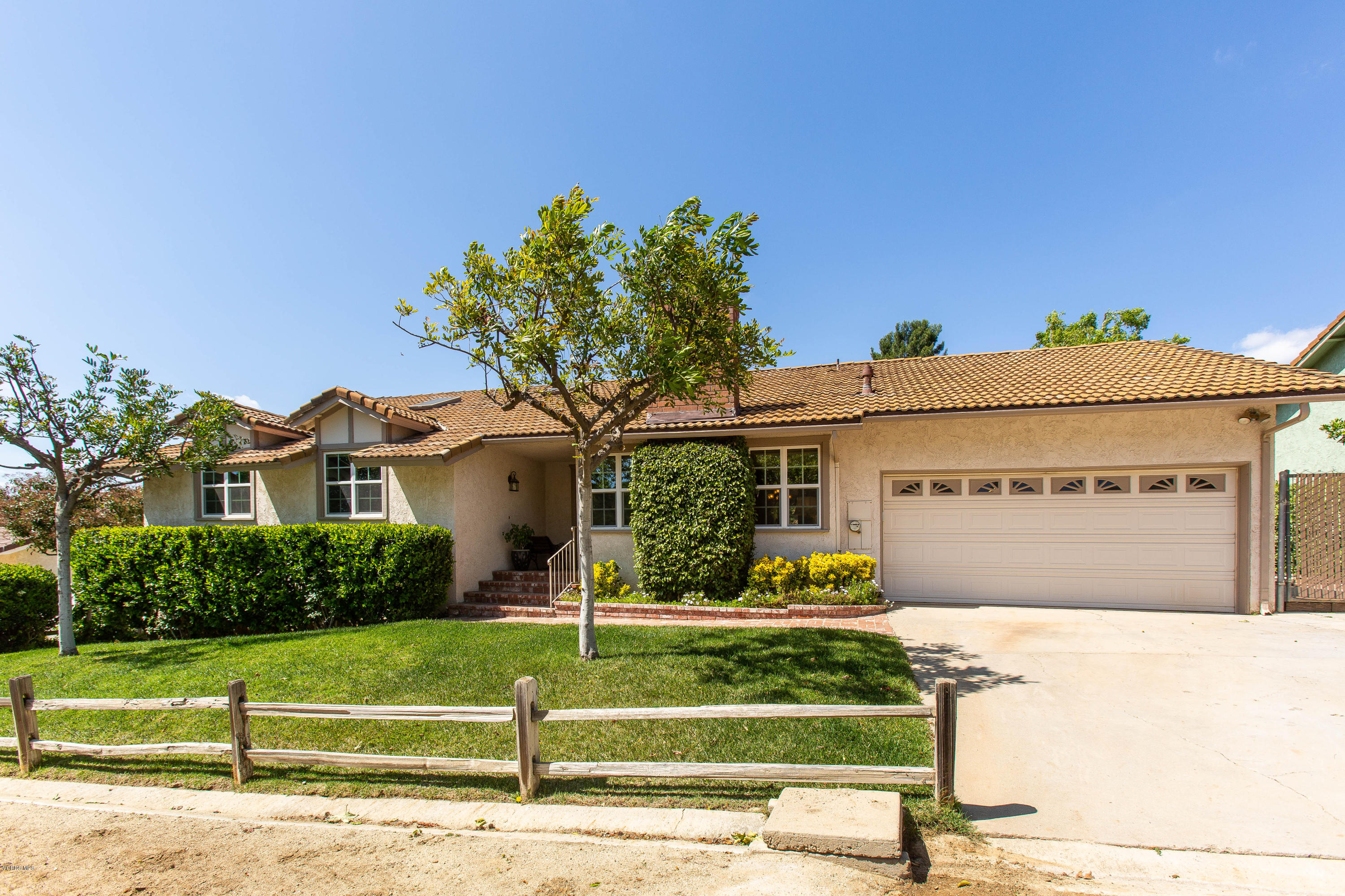1177 Rambling Road Simi Valley, CA 93065 - Photo 2 of 56 a front view of a house with a yard