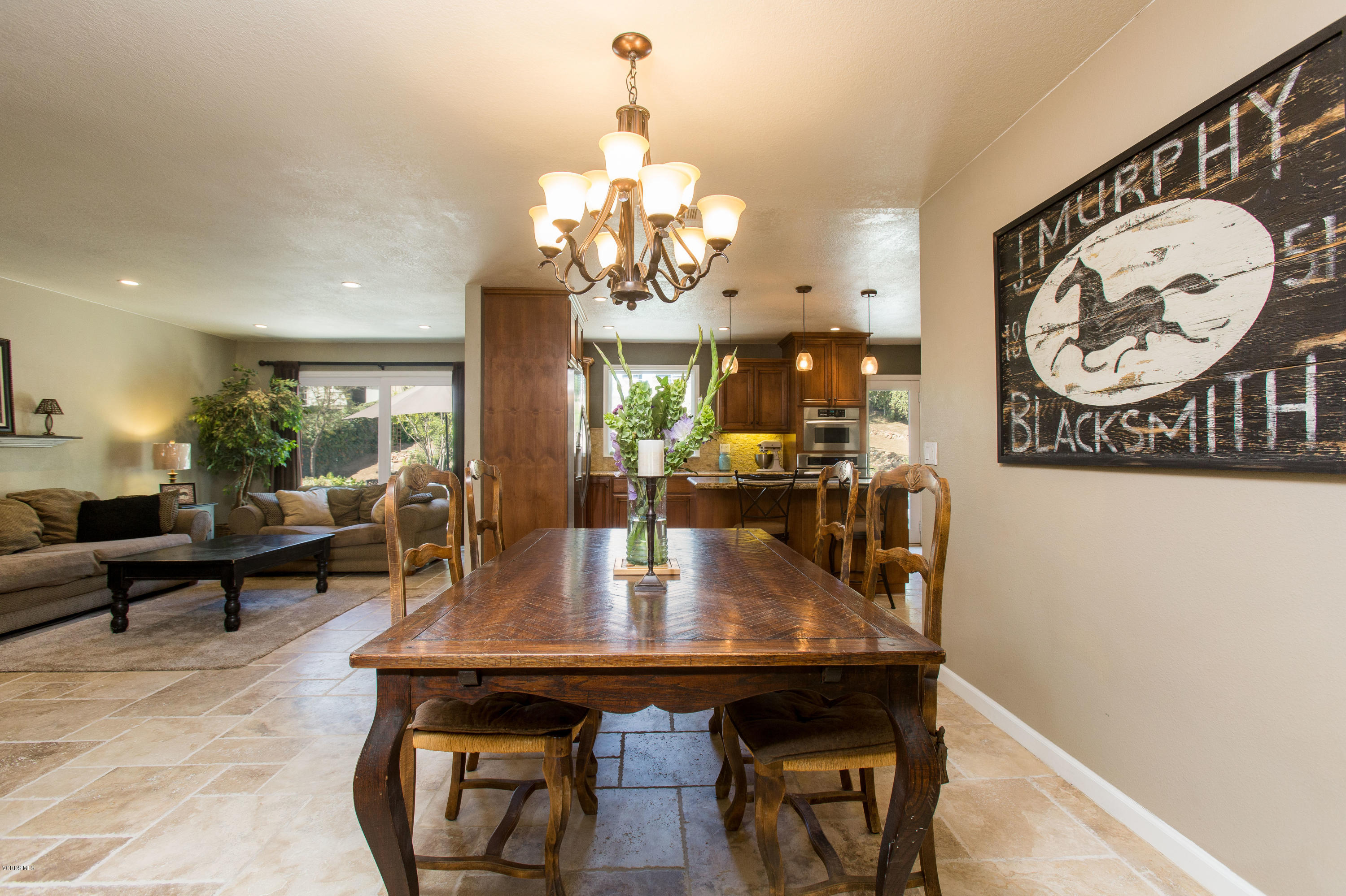 1177 Rambling Road Simi Valley, CA 93065 - Photo 15 of 56 a view of a dining room with furniture and a chandelier