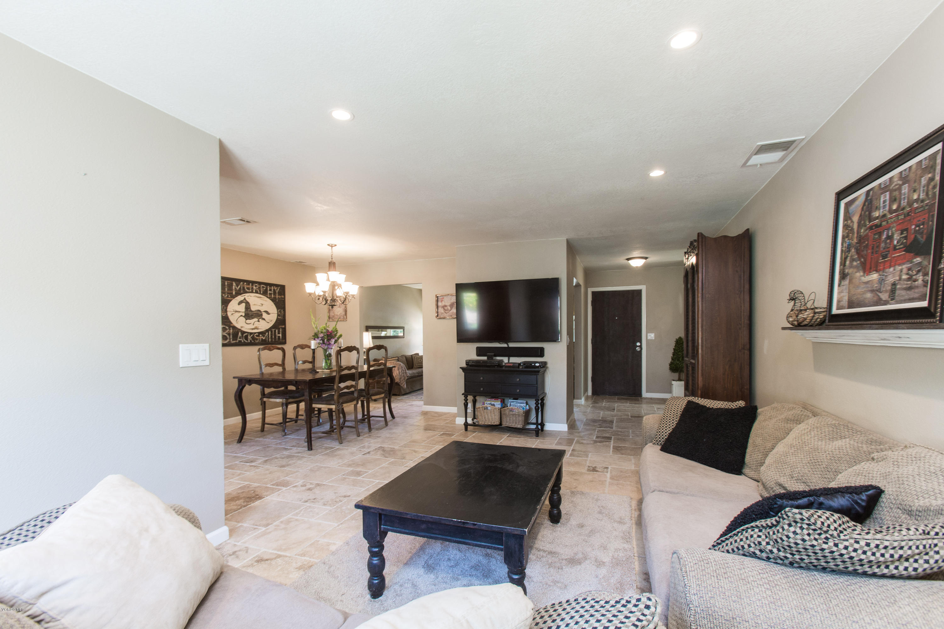 1177 Rambling Road Simi Valley, CA 93065 - Photo 18 of 56 a living room with furniture and a flat screen tv