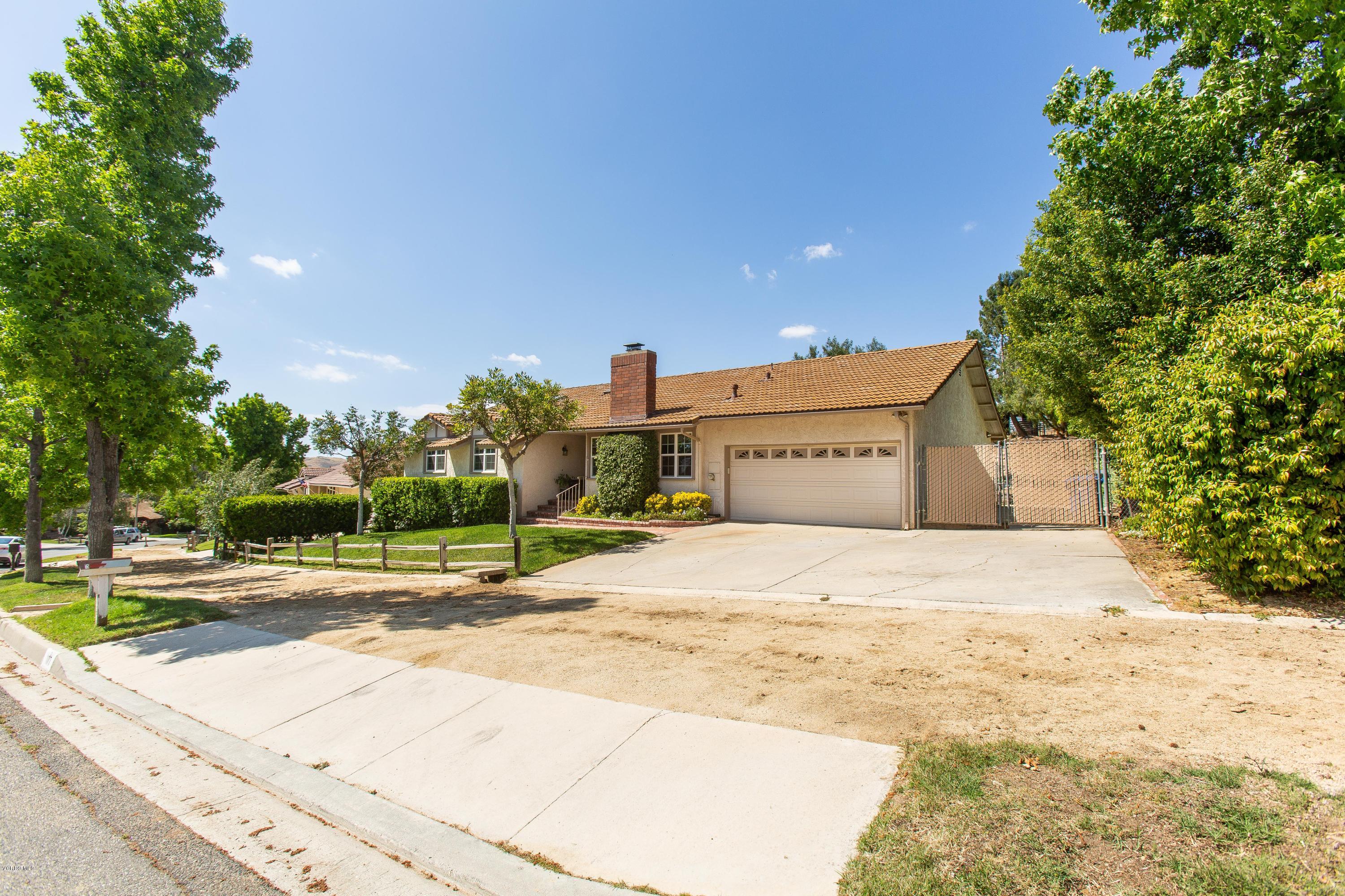 1177 Rambling Road Simi Valley, CA 93065 - Photo 3 of 56 a building with trees in front of it