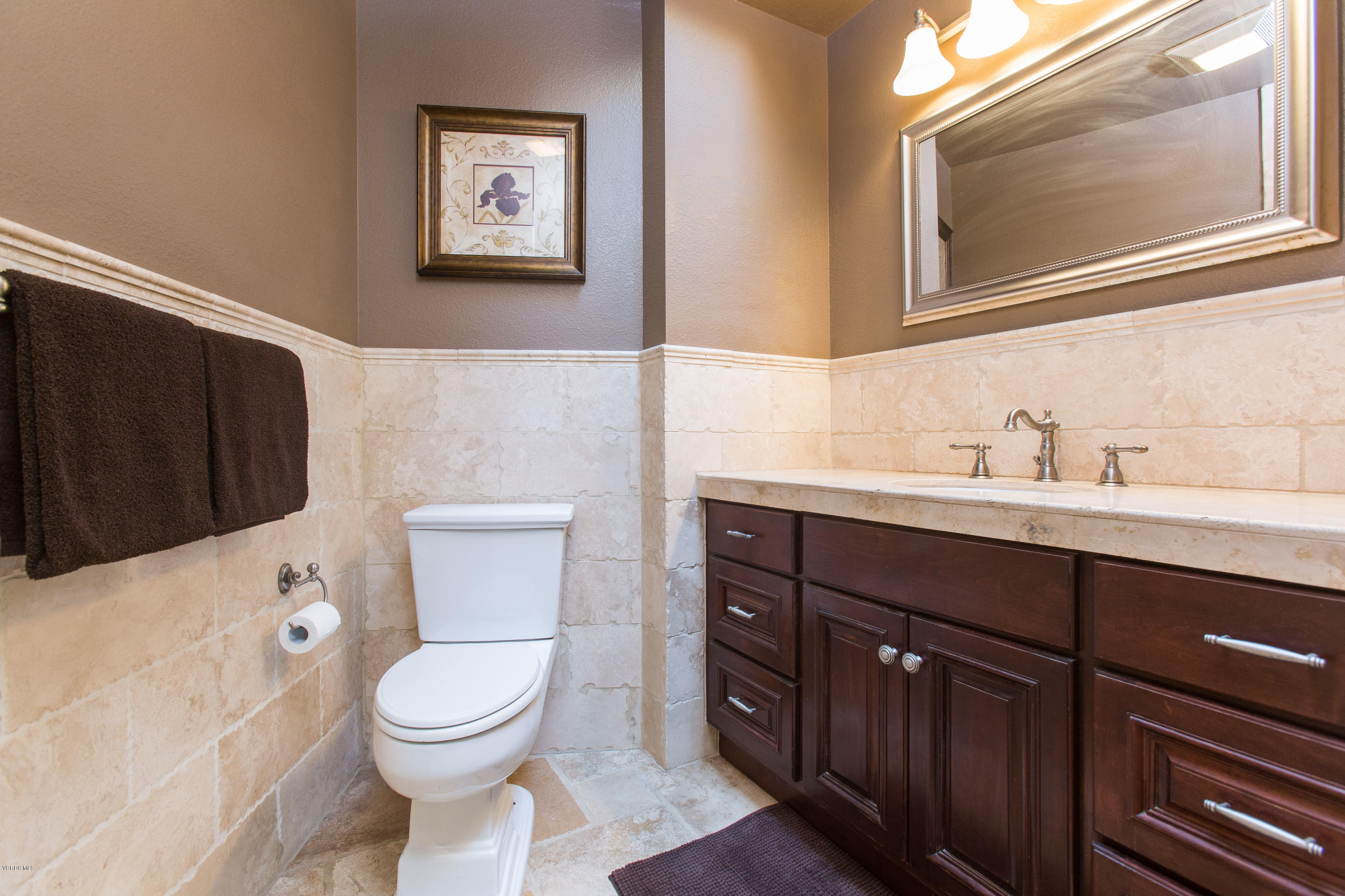 1177 Rambling Road Simi Valley, CA 93065 - Photo 24 of 56 a bathroom with a toilet a sink and mirror