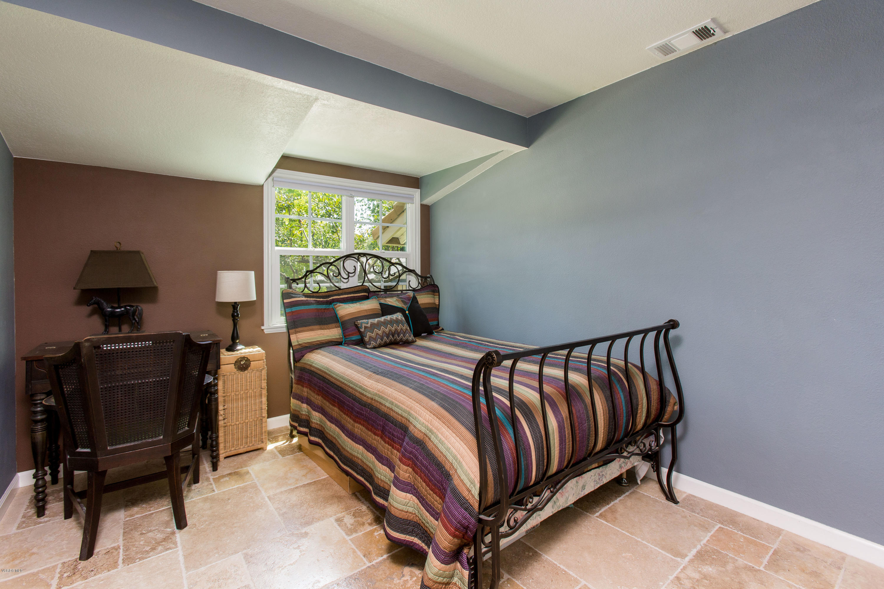 1177 Rambling Road Simi Valley, CA 93065 - Photo 28 of 56 a bedroom with a bed and a chair
