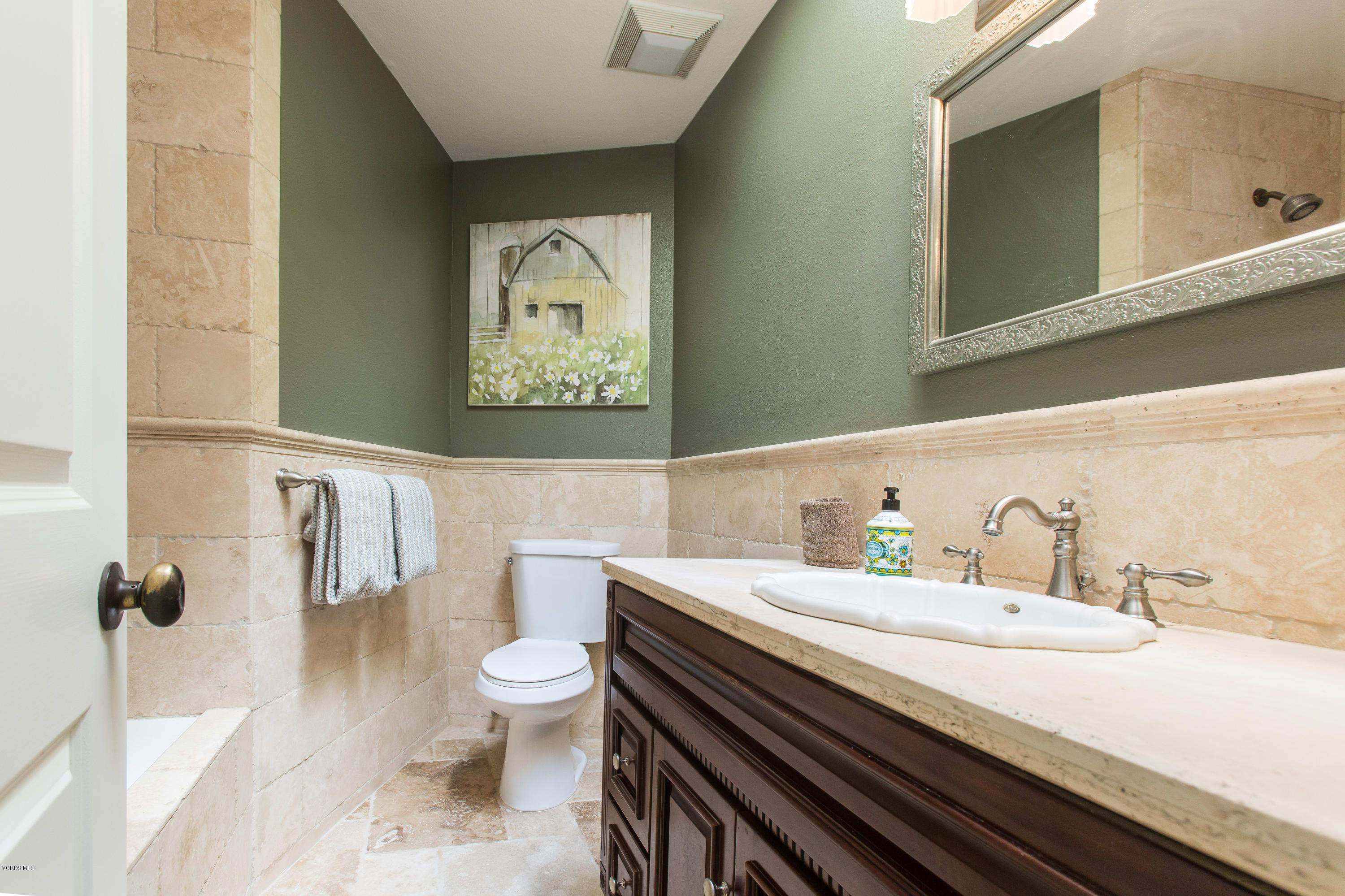 1177 Rambling Road Simi Valley, CA 93065 - Photo 30 of 56 a bathroom with a sink a toilet and a mirror