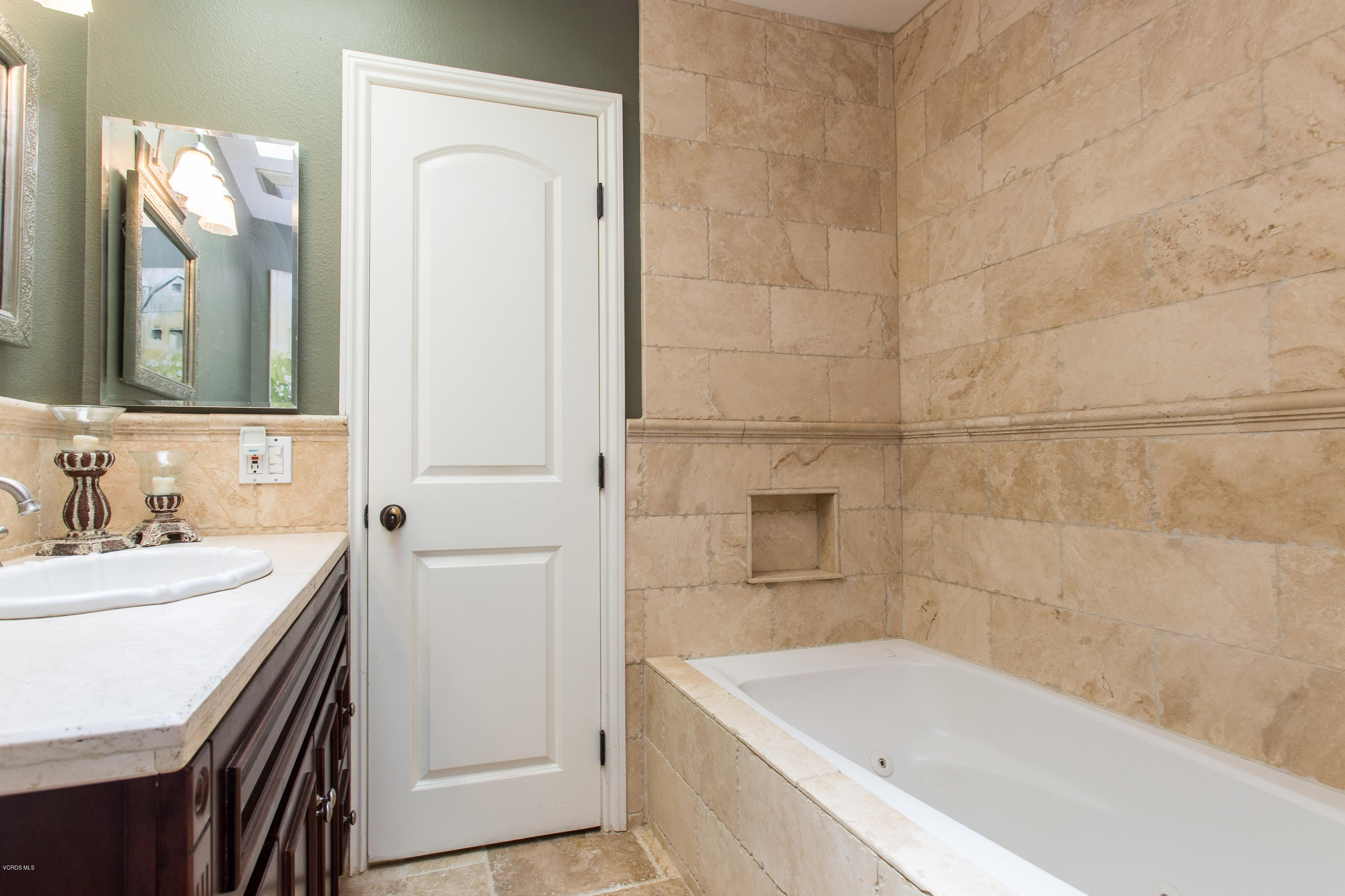 1177 Rambling Road Simi Valley, CA 93065 - Photo 31 of 56 a bathroom with a tub sink and mirror