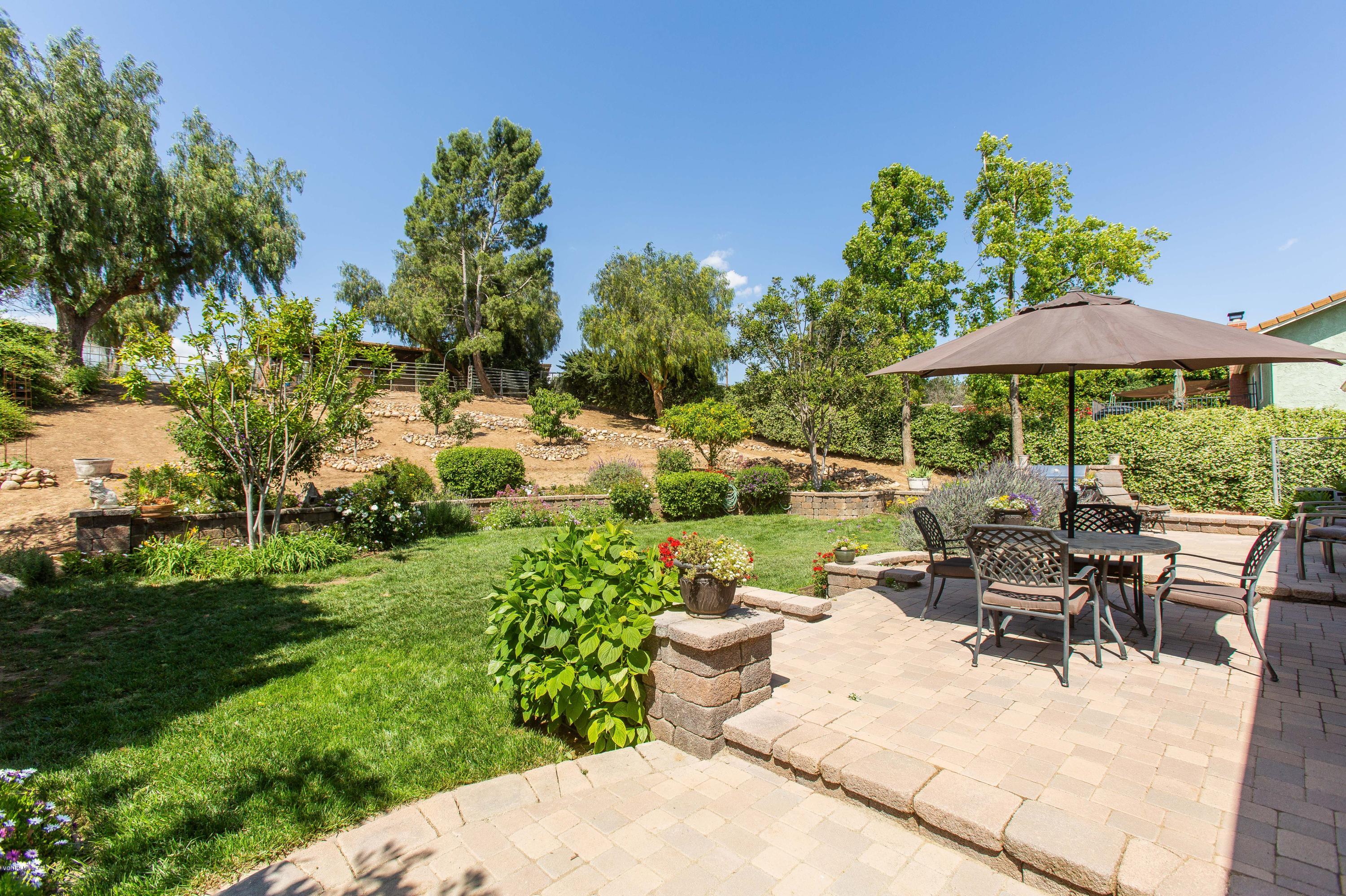 1177 Rambling Road Simi Valley, CA 93065 - Photo 37 of 56 a view of a patio with furniture and a garden
