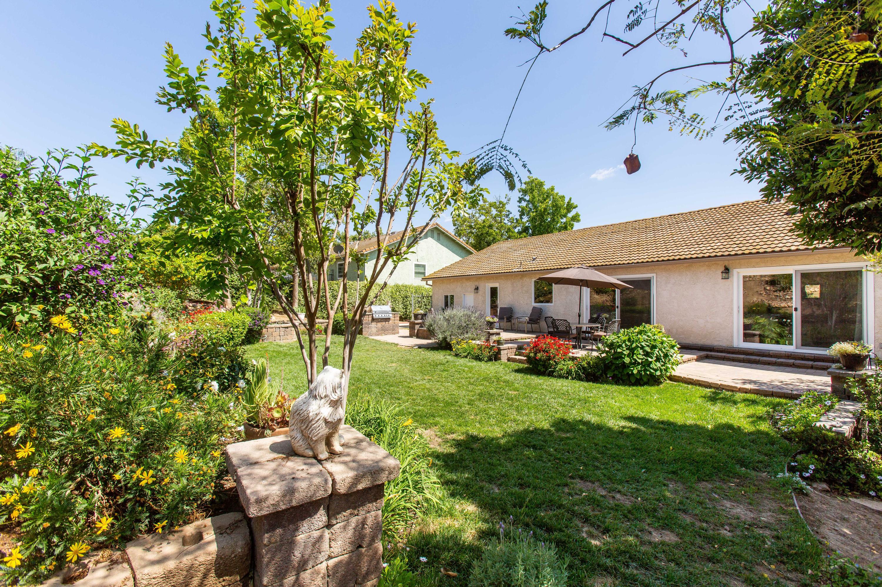 1177 Rambling Road Simi Valley, CA 93065 - Photo 39 of 56 a view of a house with a yard and sitting area
