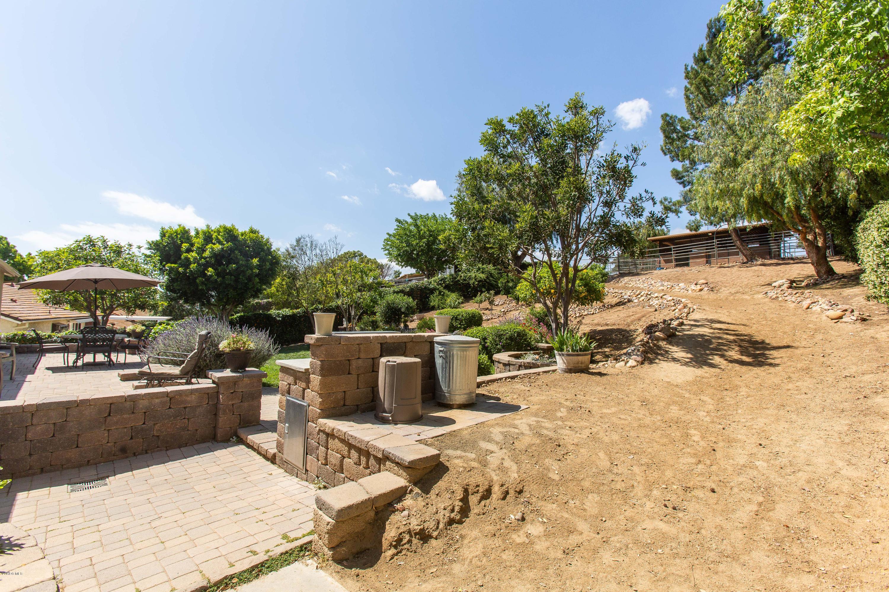 1177 Rambling Road Simi Valley, CA 93065 - Photo 41 of 56 a view of a backyard with sitting area