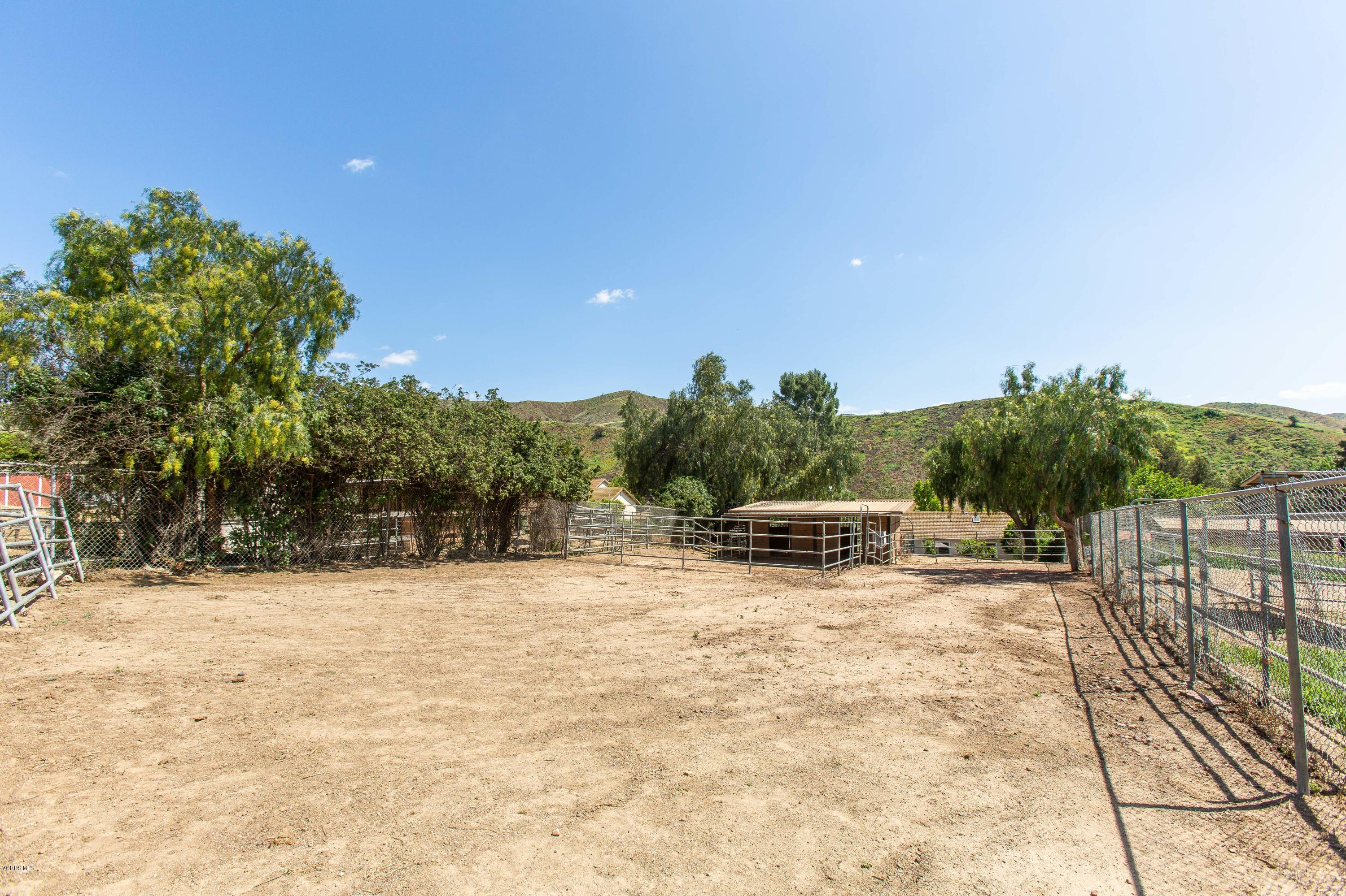 1177 Rambling Road Simi Valley, CA 93065 - Photo 44 of 56 a view of white house with a yard