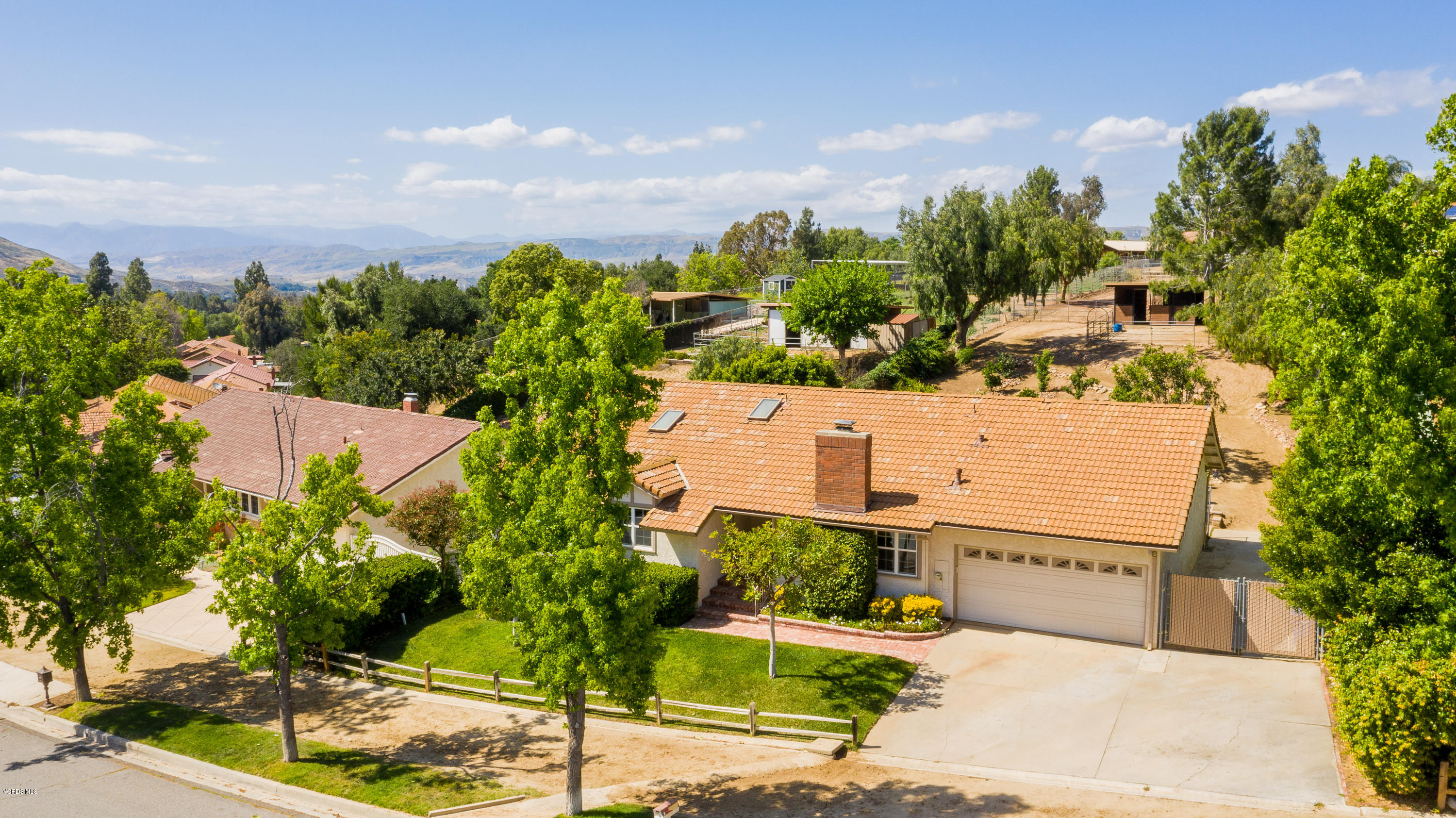 1177 Rambling Road Simi Valley, CA 93065 - Photo 6 of 56 aerial view of a house with a yard and plant in front of it