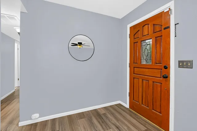 a bedroom with a bed and ceiling fan