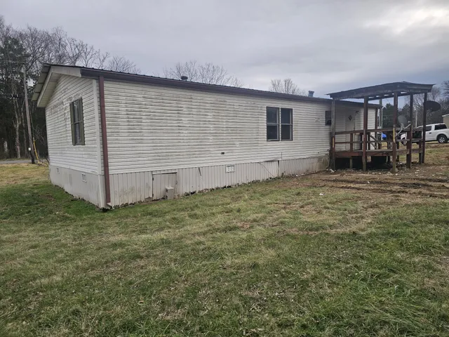 a house with trees in the background