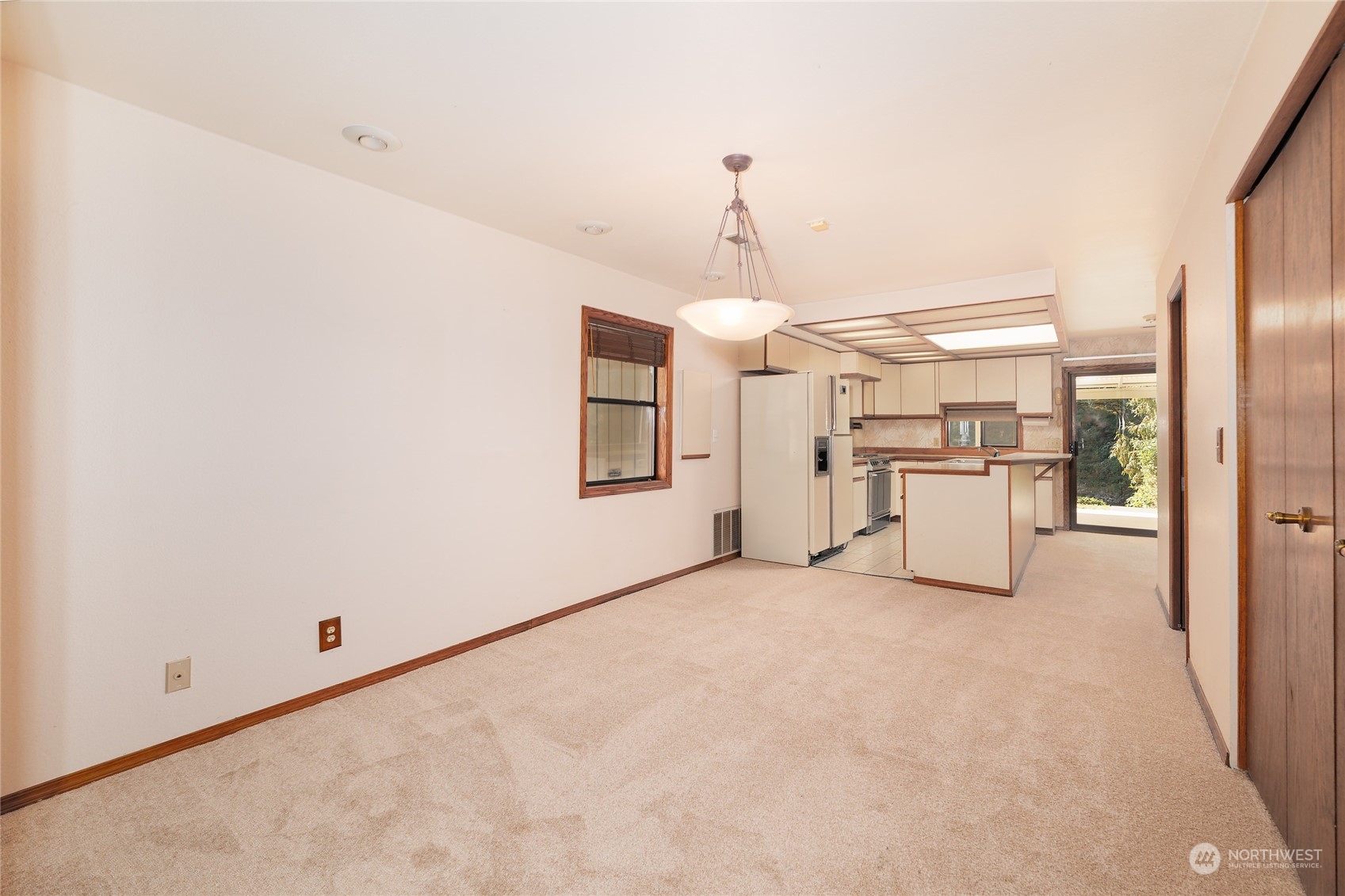 3225 Southeast 7th Street Renton, WA 98057 - Photo 5 of 26 a view of a kitchen with furniture and an empty room