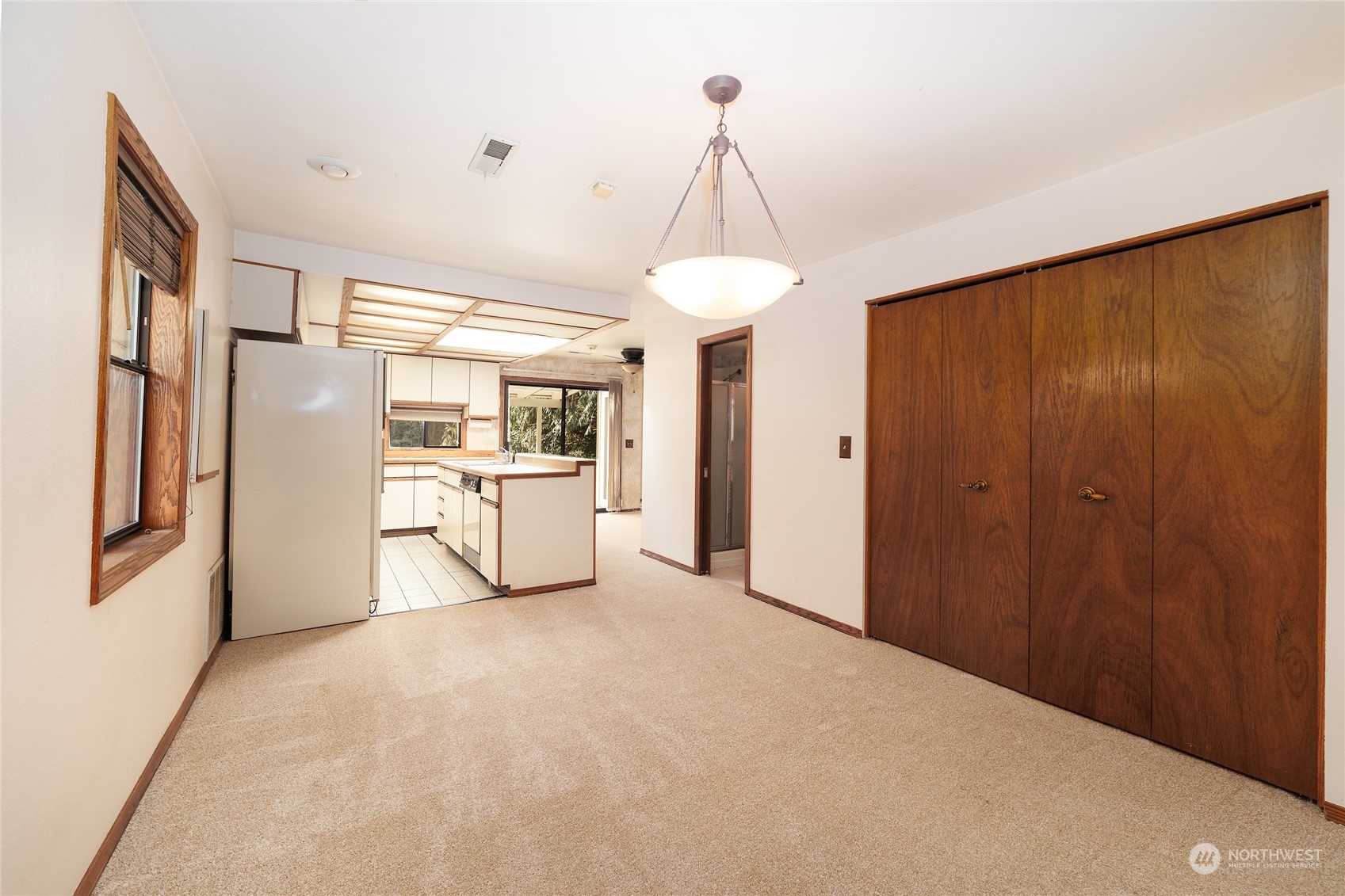 3225 Southeast 7th Street Renton, WA 98057 - Photo 6 of 26 a kitchen with stainless steel appliances a refrigerator and cabinets