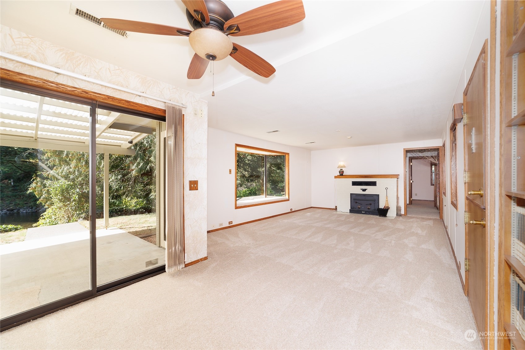 3225 Southeast 7th Street Renton, WA 98057 - Photo 8 of 26 a view of an empty room with a window and kitchen view