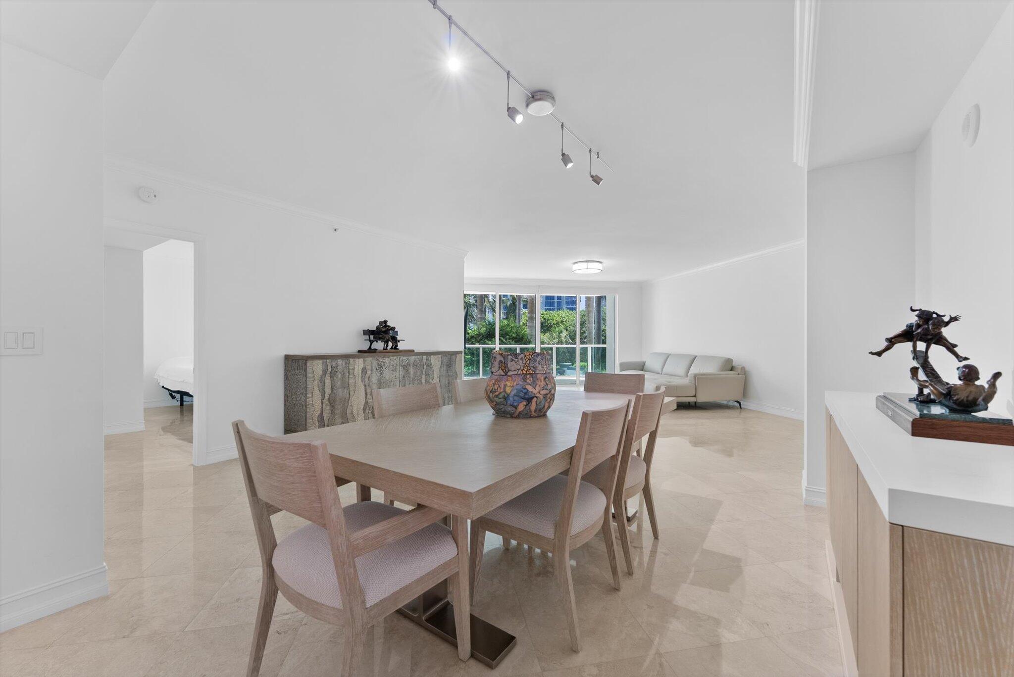 550 Southeast Mizner Boulevard, Unit B206 Boca Raton, FL 33432 - Photo 21 of 65 a view of a dining room with furniture and a large window