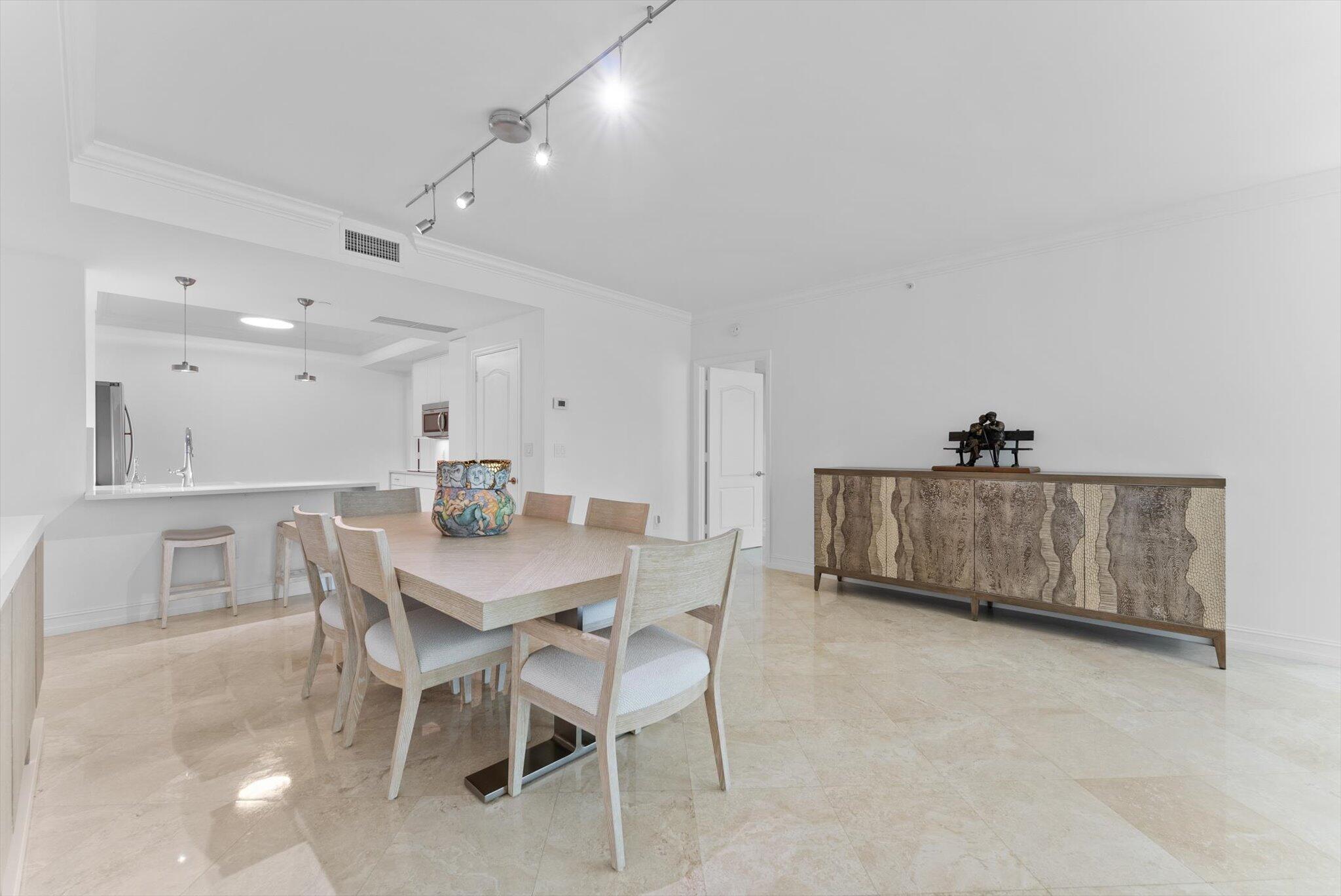550 Southeast Mizner Boulevard, Unit B206 Boca Raton, FL 33432 - Photo 22 of 65 a view of a dining room with furniture
