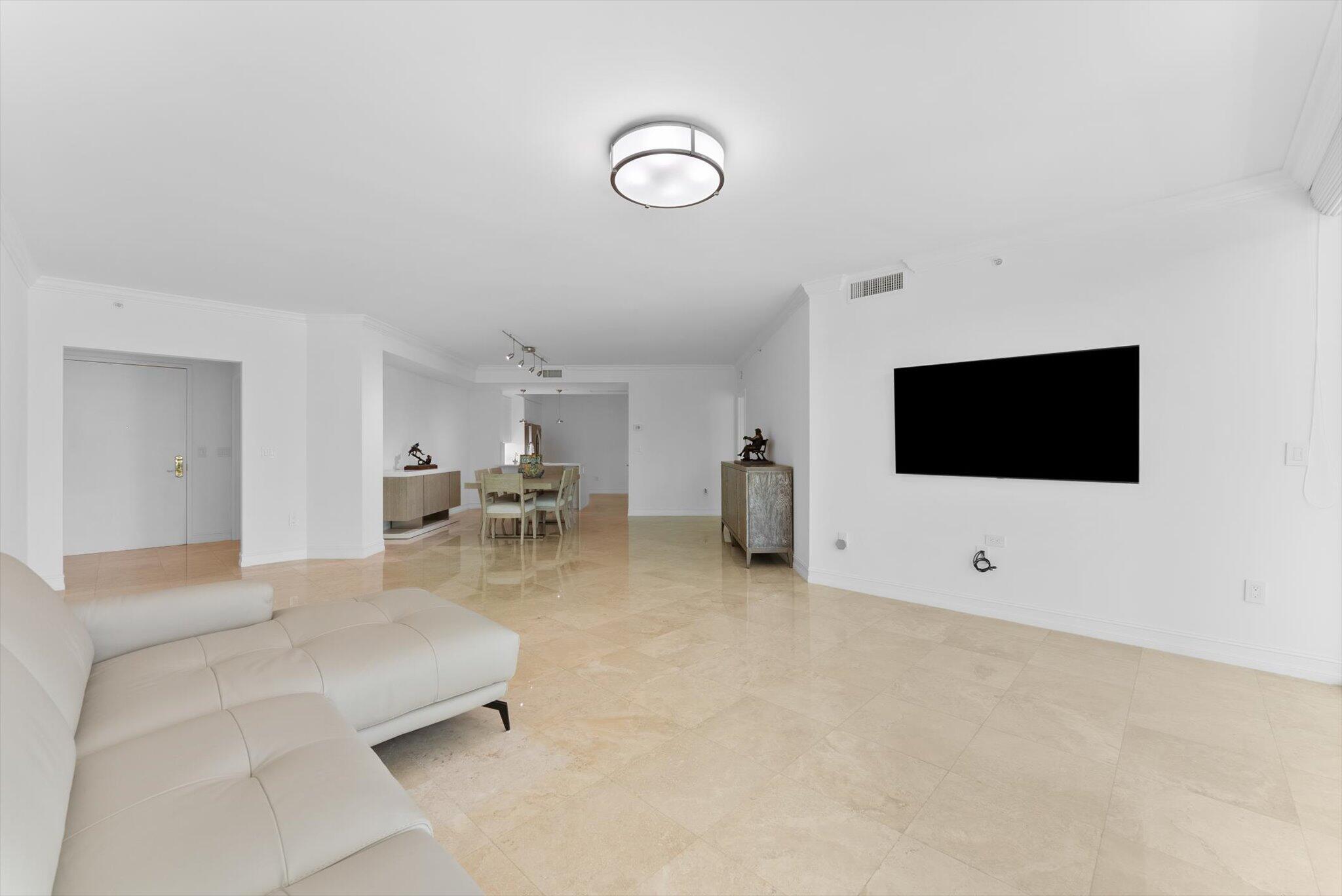550 Southeast Mizner Boulevard, Unit B206 Boca Raton, FL 33432 - Photo 29 of 65 a living room with furniture and a flat screen tv