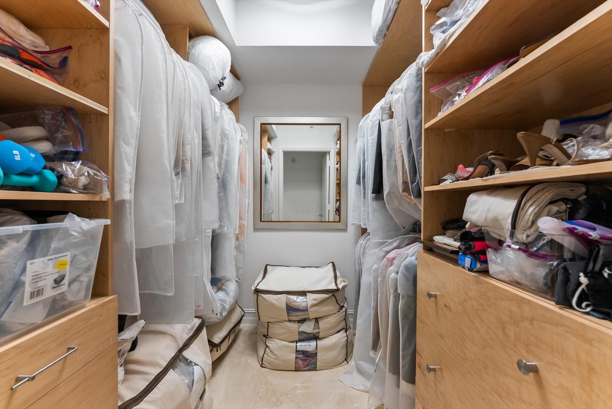 550 Southeast Mizner Boulevard, Unit B206 Boca Raton, FL 33432 - Photo 35 of 65 a view of walk in closet with clothes and shoes