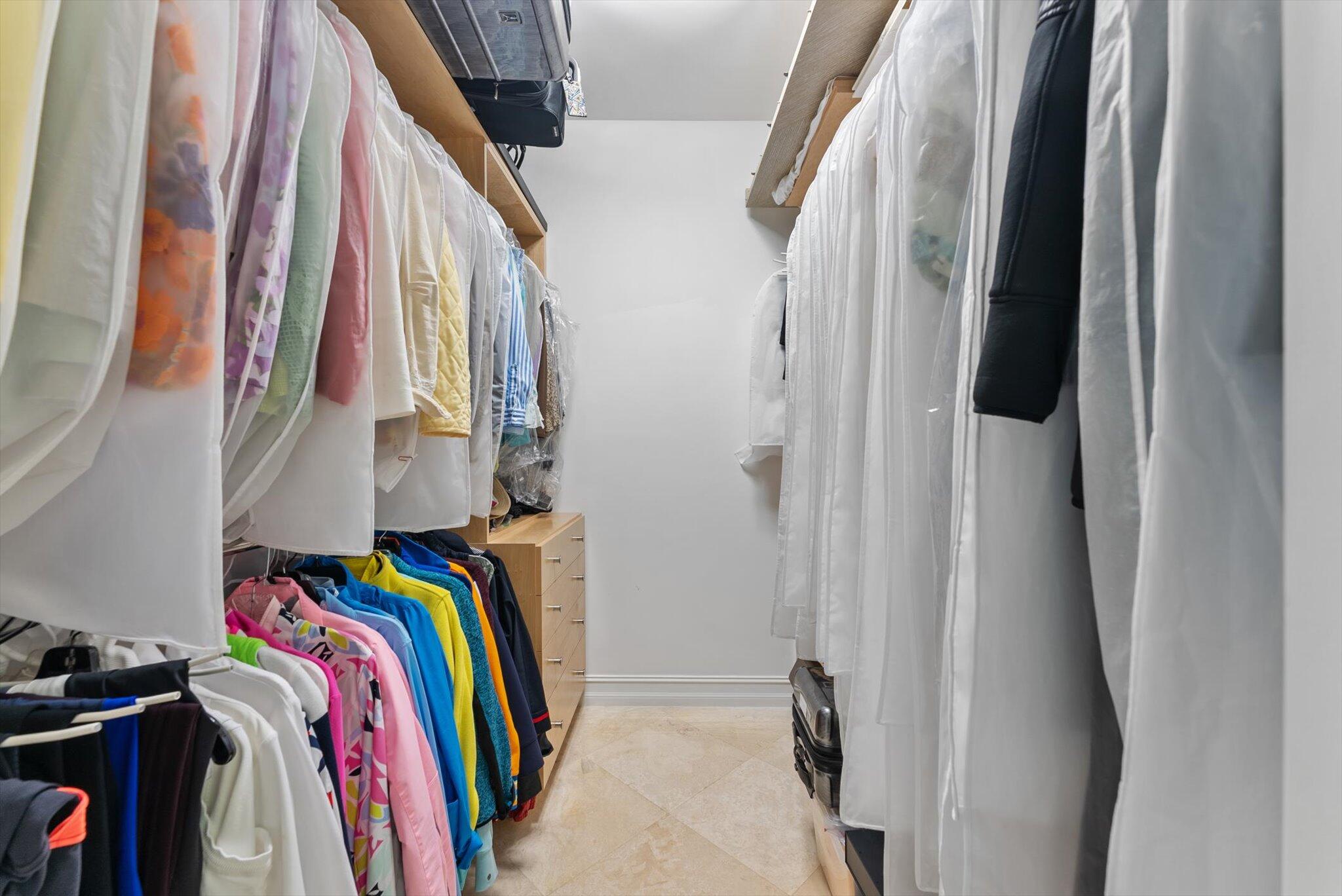 550 Southeast Mizner Boulevard, Unit B206 Boca Raton, FL 33432 - Photo 36 of 65 a view of walk in closet with clothes and shoes