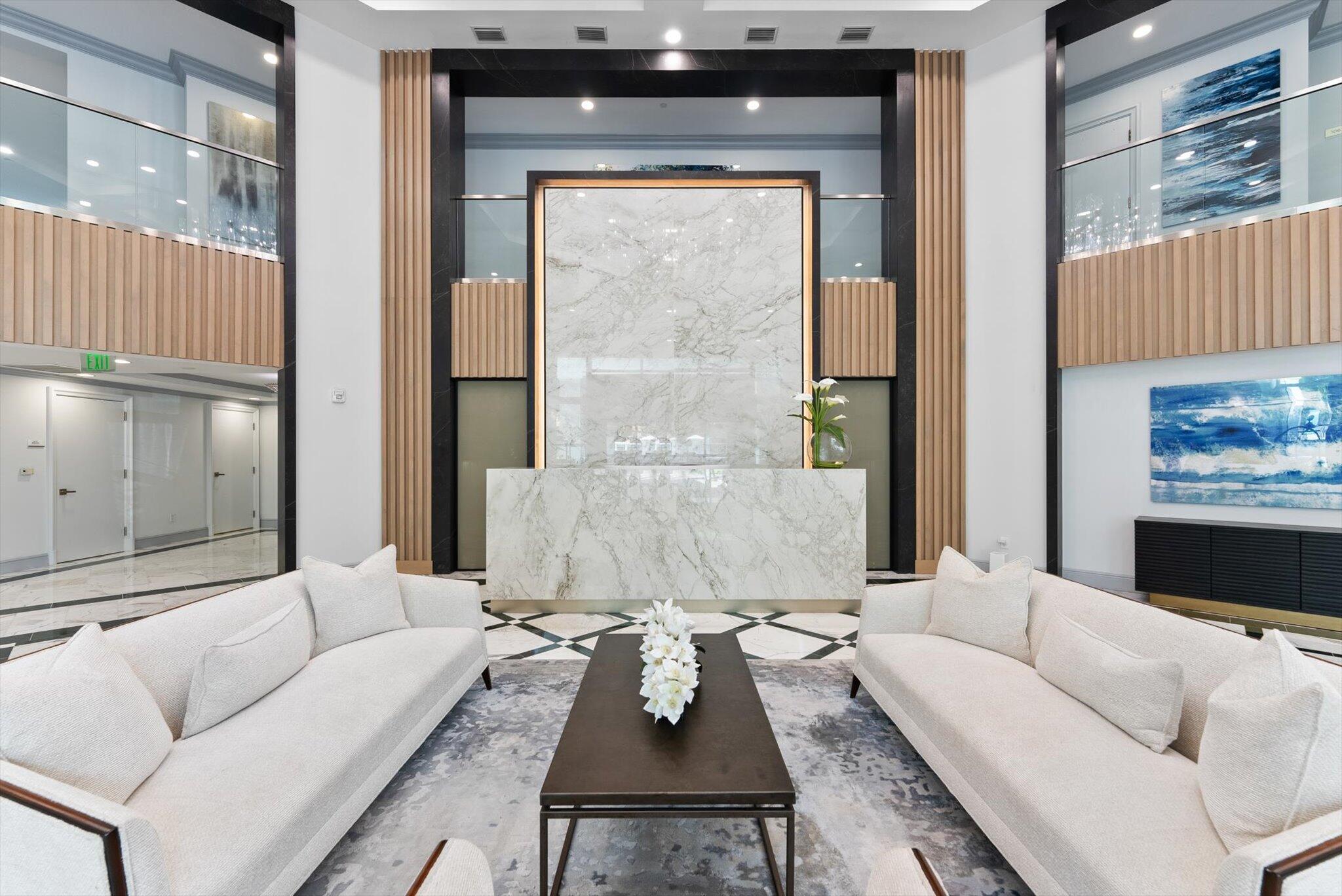 550 Southeast Mizner Boulevard, Unit B206 Boca Raton, FL 33432 - Photo 40 of 65 a living room with furniture and a fireplace