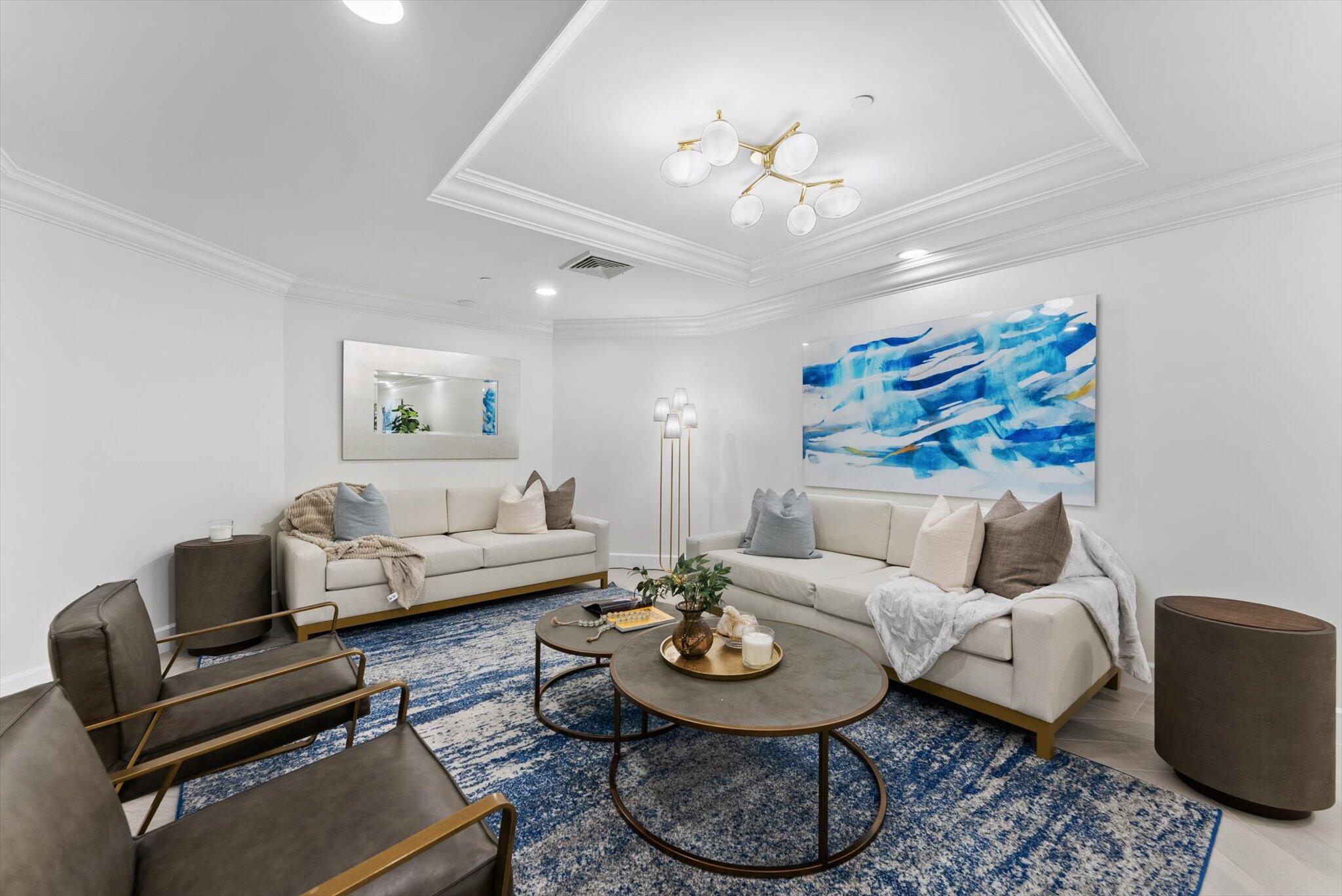 550 Southeast Mizner Boulevard, Unit B206 Boca Raton, FL 33432 - Photo 42 of 65 a living room with furniture and a chandelier