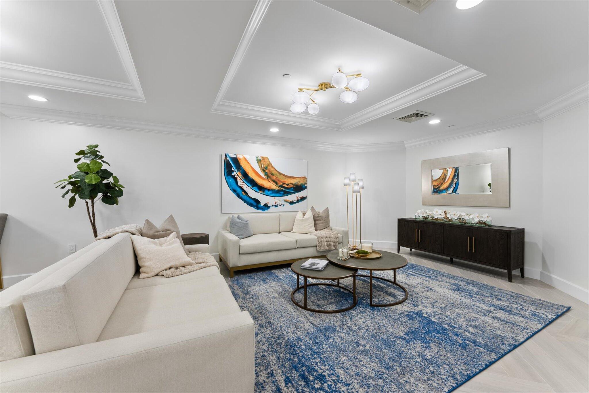 550 Southeast Mizner Boulevard, Unit B206 Boca Raton, FL 33432 - Photo 43 of 65 a living room with furniture and a rug