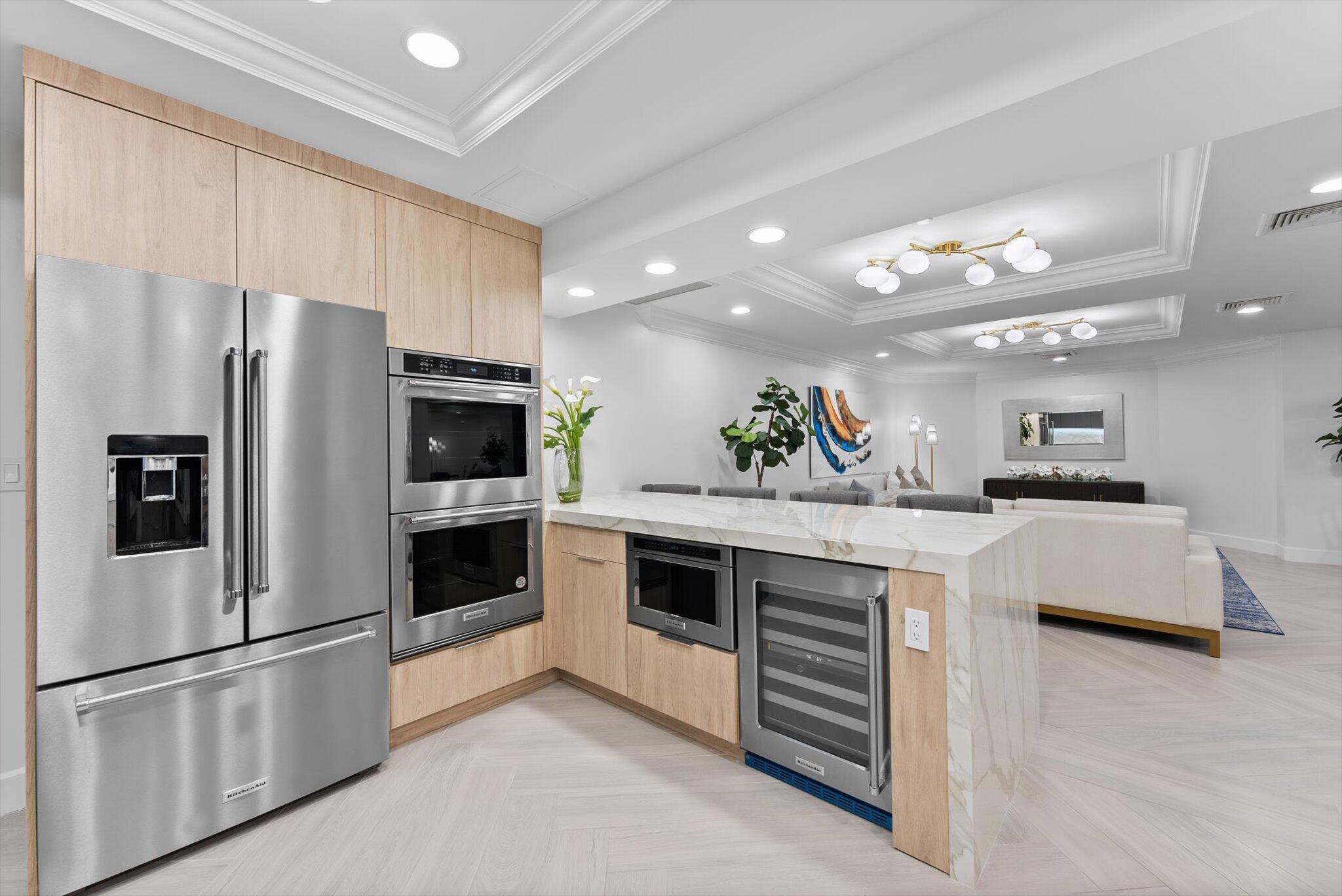 550 Southeast Mizner Boulevard, Unit B206 Boca Raton, FL 33432 - Photo 45 of 65 a kitchen with stainless steel appliances a refrigerator sink and stove
