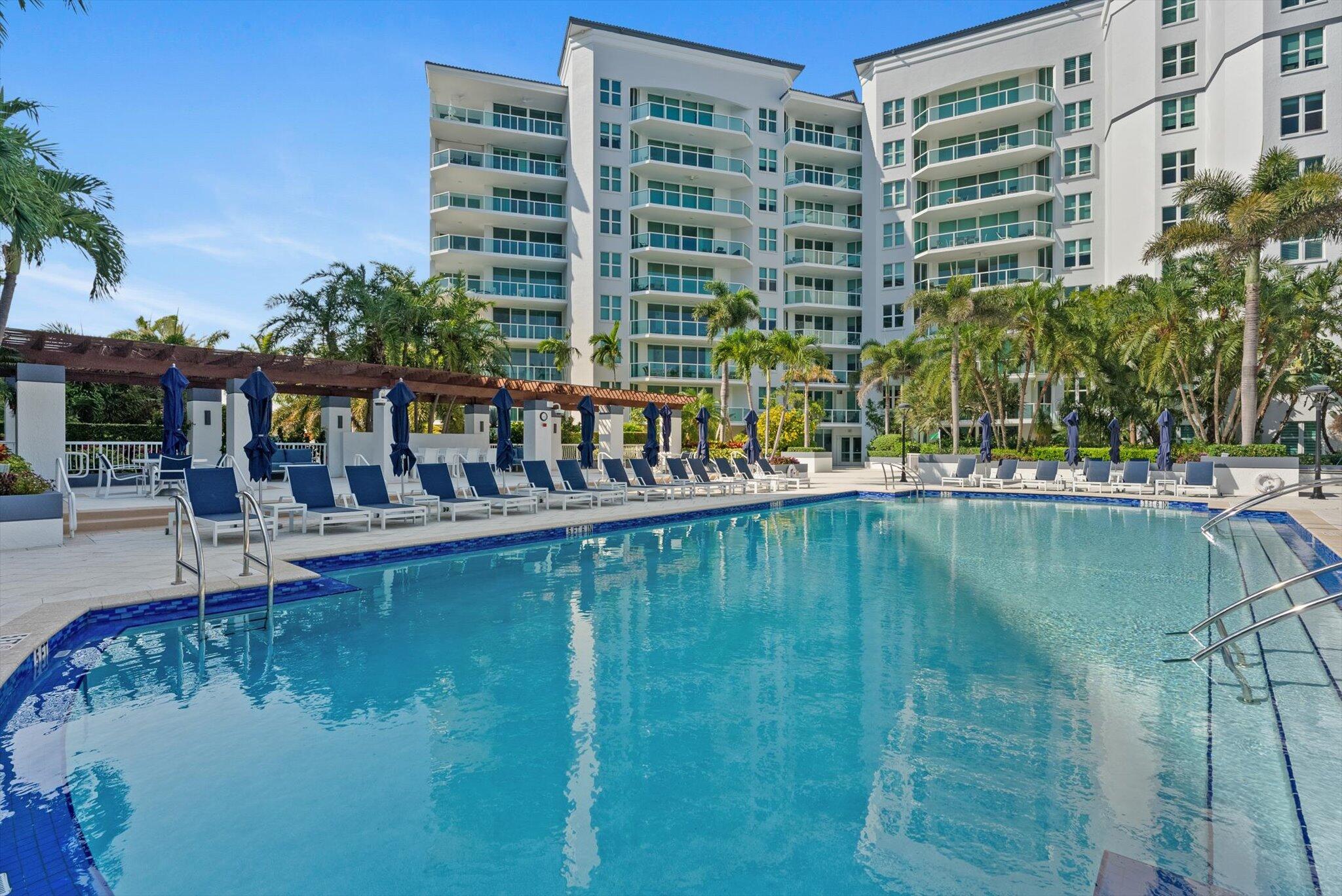 550 Southeast Mizner Boulevard, Unit B206 Boca Raton, FL 33432 - Photo 51 of 65 a view of swimming pool with outdoor seating and lake view