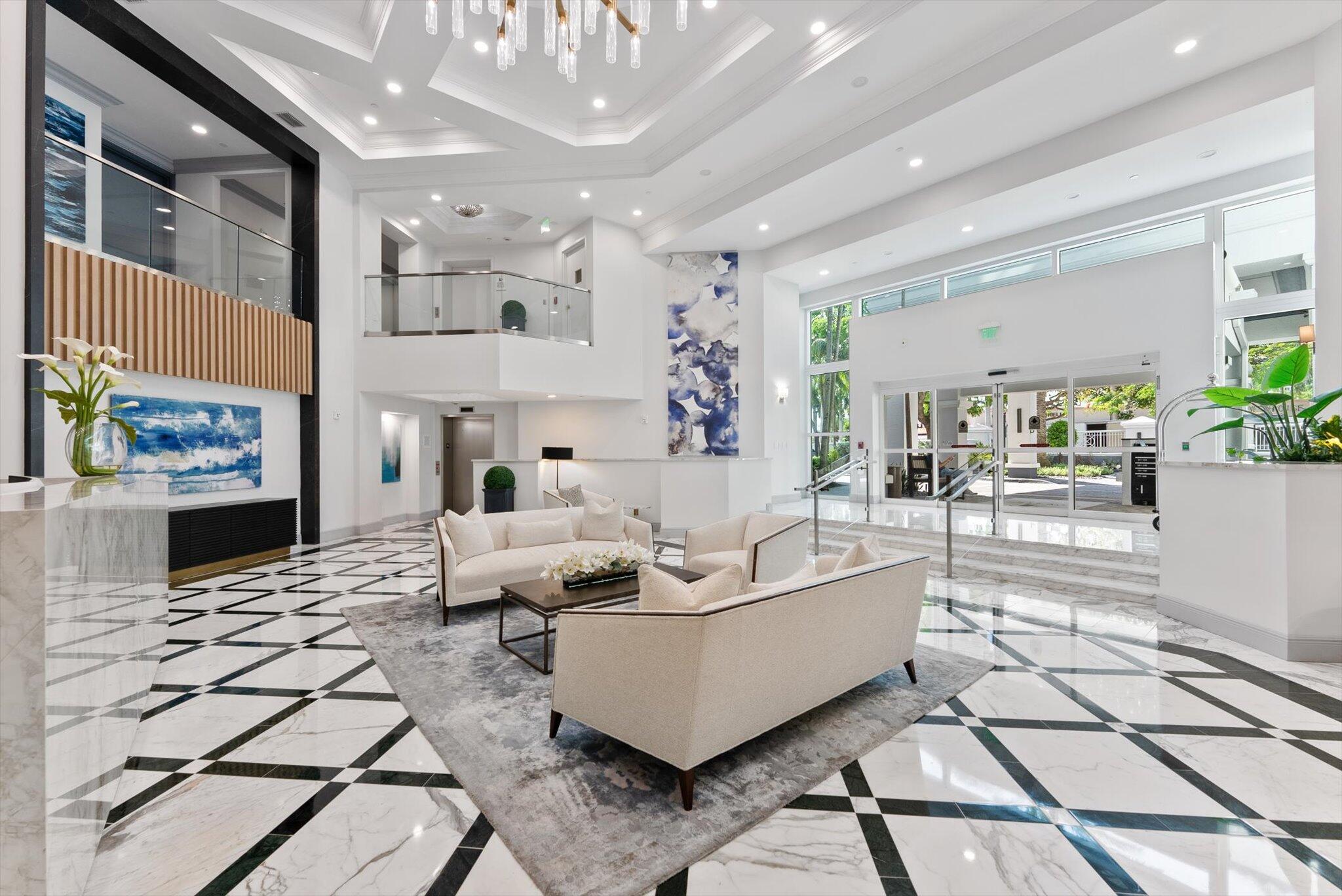 550 Southeast Mizner Boulevard, Unit B206 Boca Raton, FL 33432 - Photo 6 of 65 a living room with fireplace furniture and a chandelier