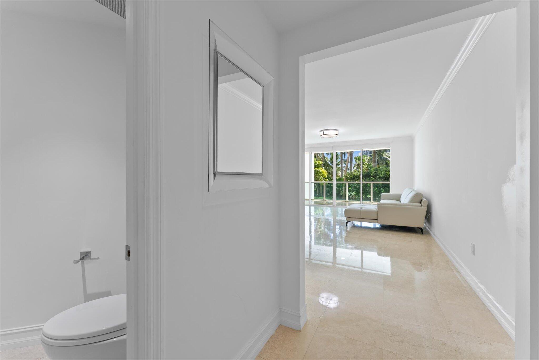 550 Southeast Mizner Boulevard, Unit B206 Boca Raton, FL 33432 - Photo 10 of 65 a bedroom with a bed and a window