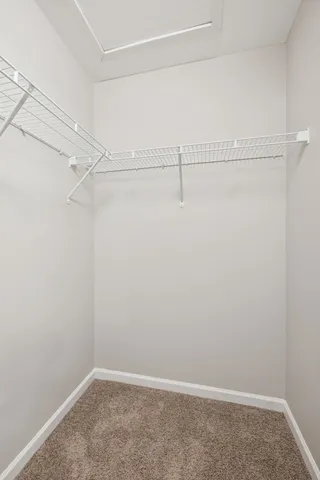 a view of an empty walk in closet