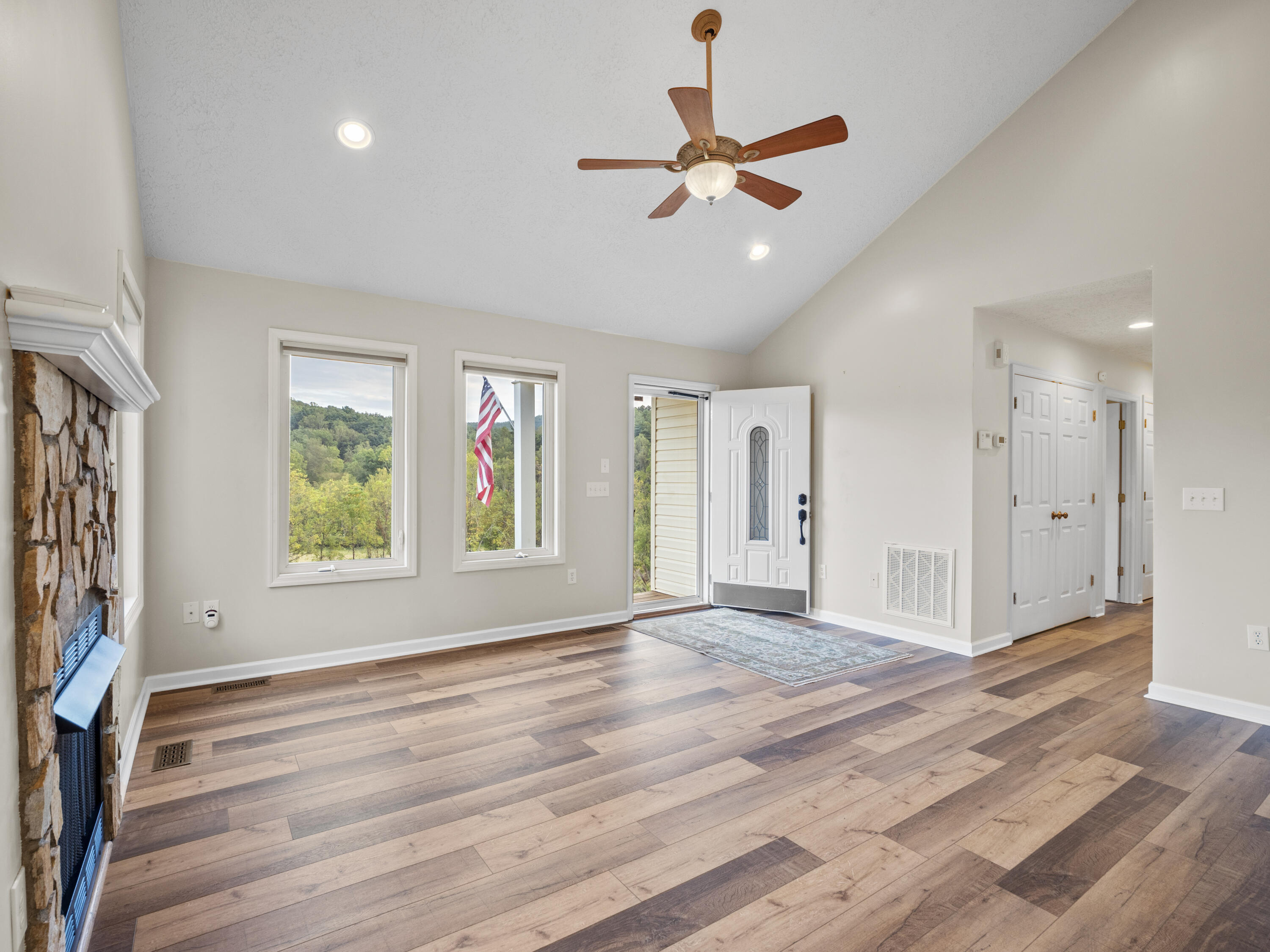 885 Whetstone Road Ferrum, VA 24088 - Photo 10 of 64 a view of an empty room with wooden floor and a window