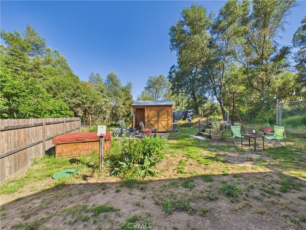 4208 Ramsden Road Mariposa, CA 95338 - Photo 34 of 42 a backyard of a house with a yard and outdoor seating