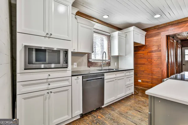 a kitchen that has a stove and a table