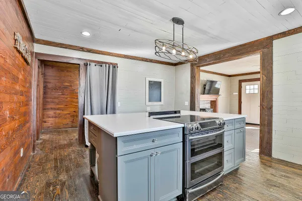 a room with furniture and wooden floor