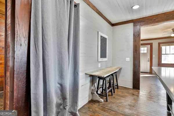 a kitchen with a sink appliances and cabinets
