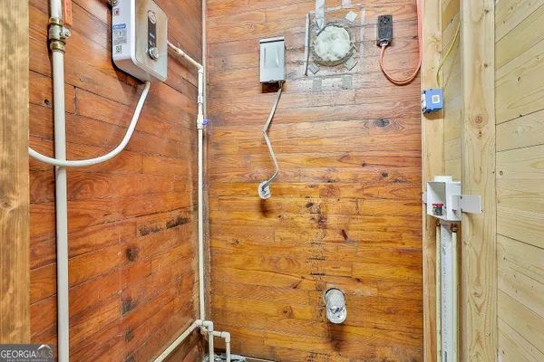 a bedroom with a bed dresser and a window