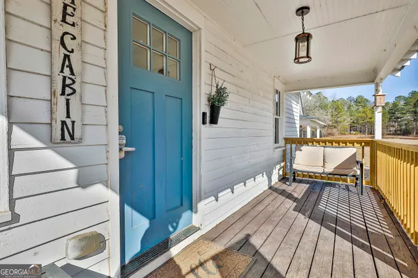 a balcony view with a seating space