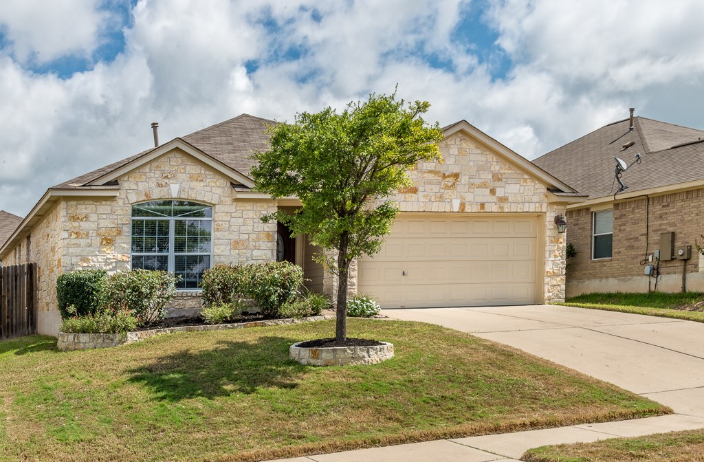 1904 Bird Call Pass Austin, TX 78754 - Photo 1 of 1 a front view of a house with garden