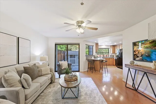 a living room with furniture and a large window
