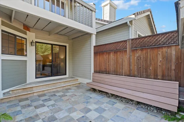 a view of wooden house with a large window