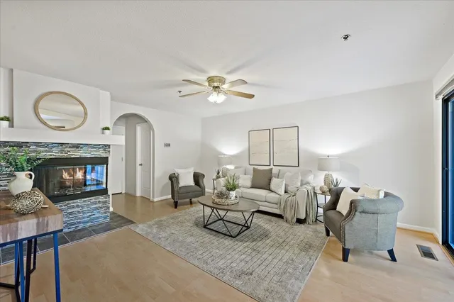 a living room with furniture and a fireplace