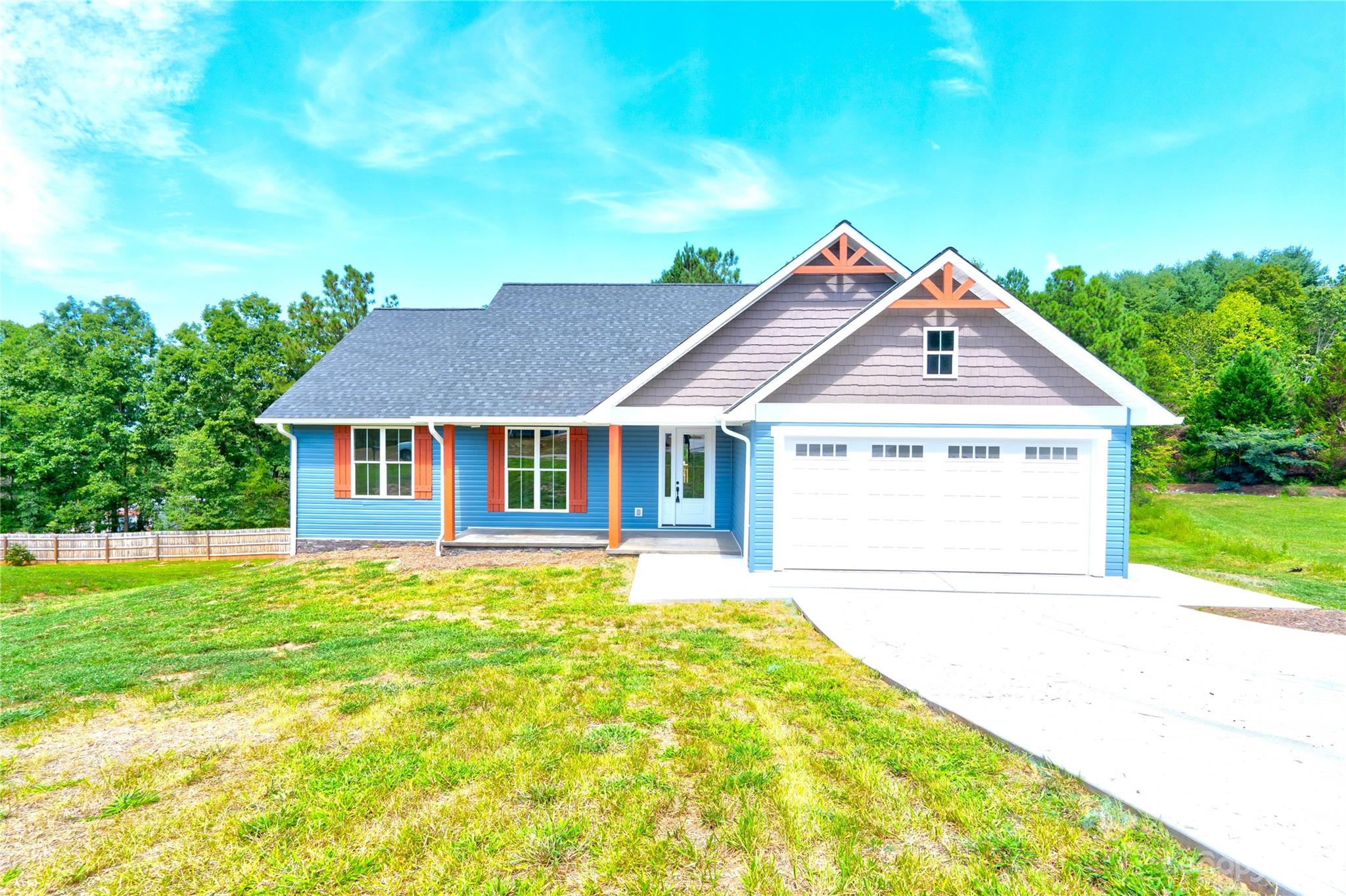 4326 Boulder Drive Morganton, NC 28655 - Photo 1 of 46 a house with green field in front of it