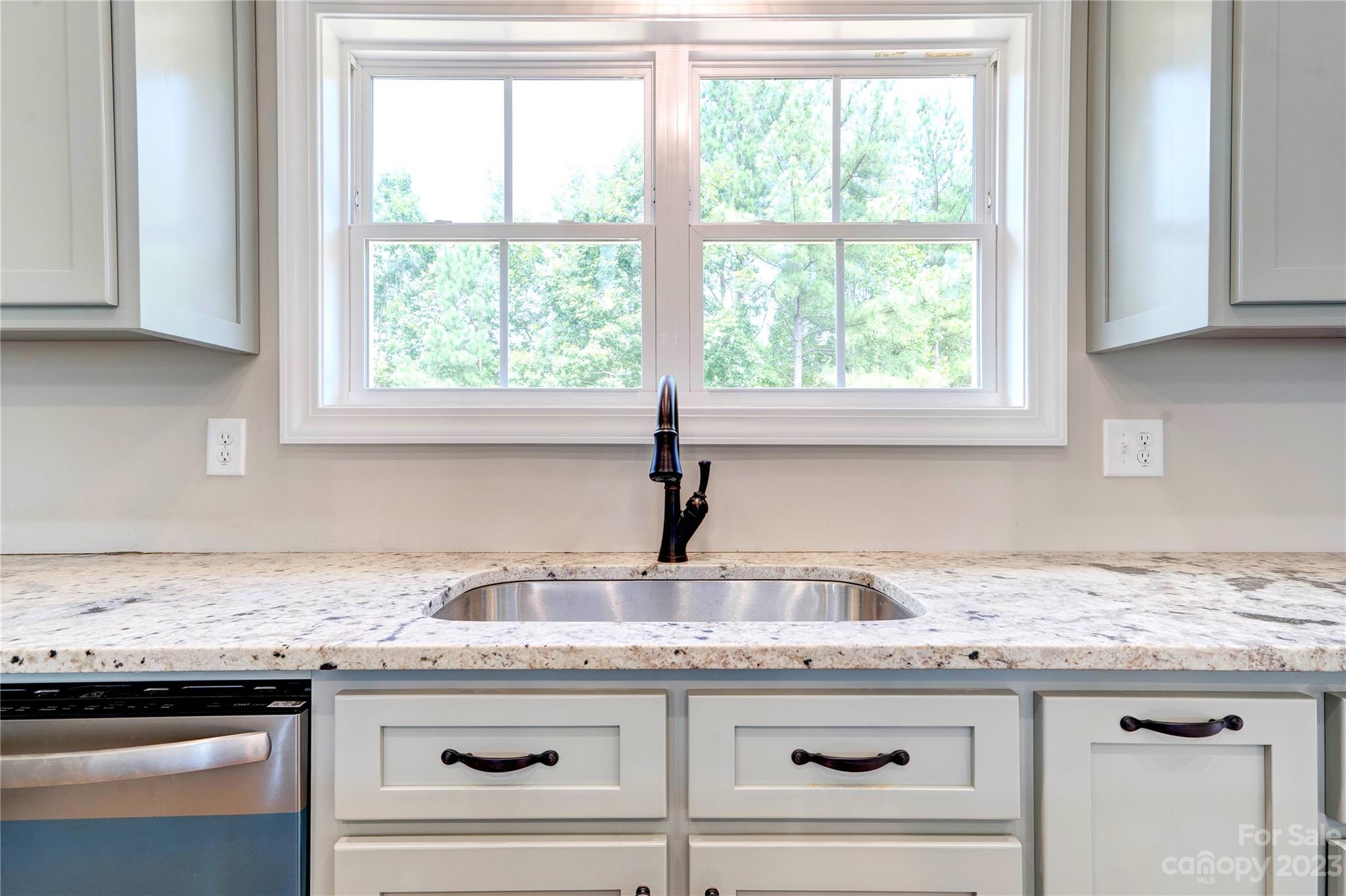 4326 Boulder Drive Morganton, NC 28655 - Photo 13 of 46 a kitchen with granite countertop a sink and a window