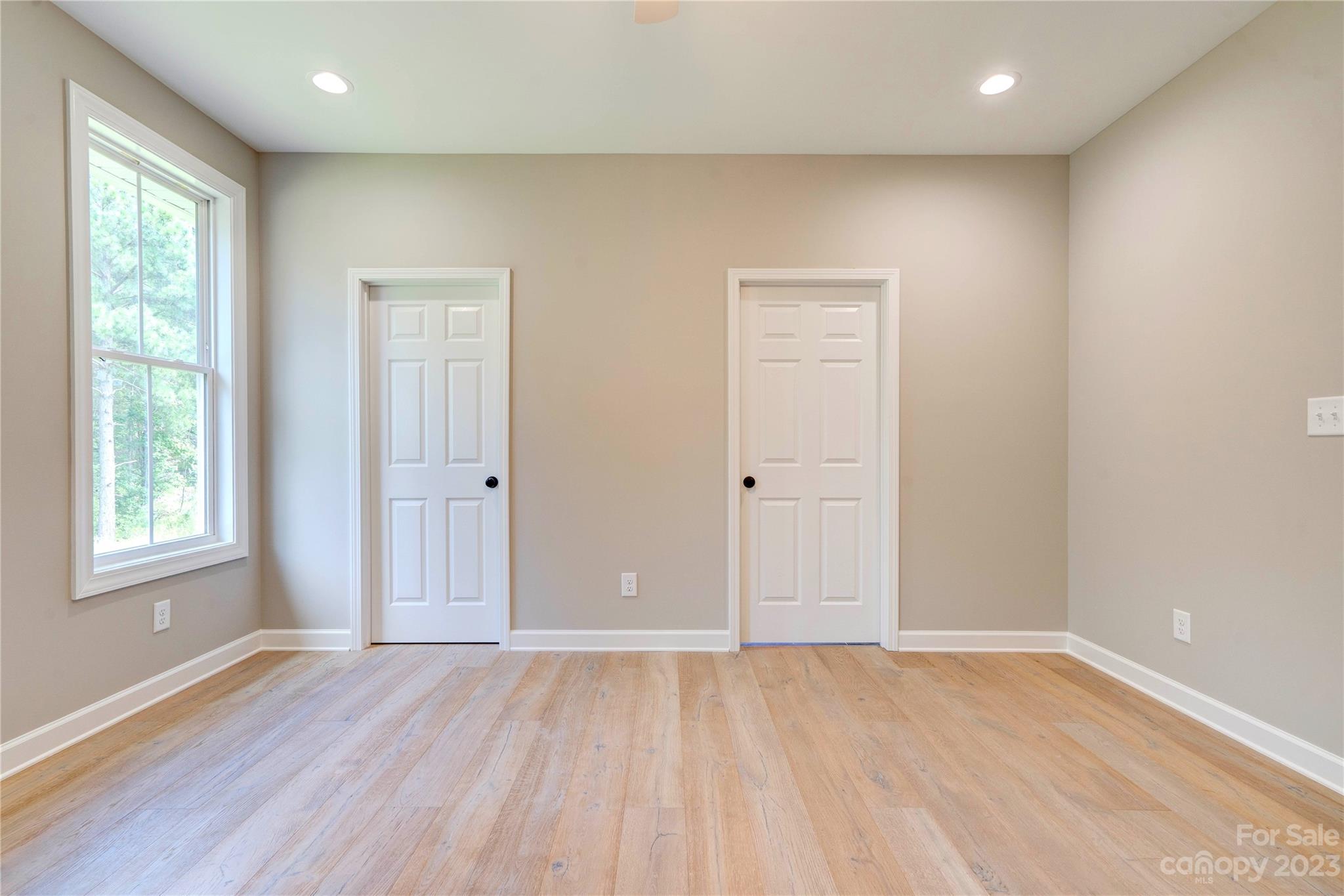 4326 Boulder Drive Morganton, NC 28655 - Photo 18 of 46 a view of empty room with wooden floor and fan