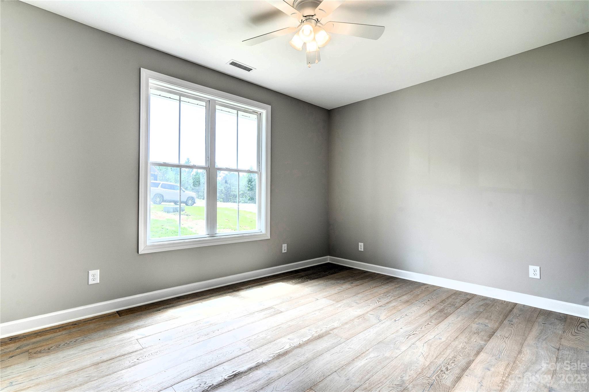 4326 Boulder Drive Morganton, NC 28655 - Photo 26 of 46 wooden floor in an empty room with a window