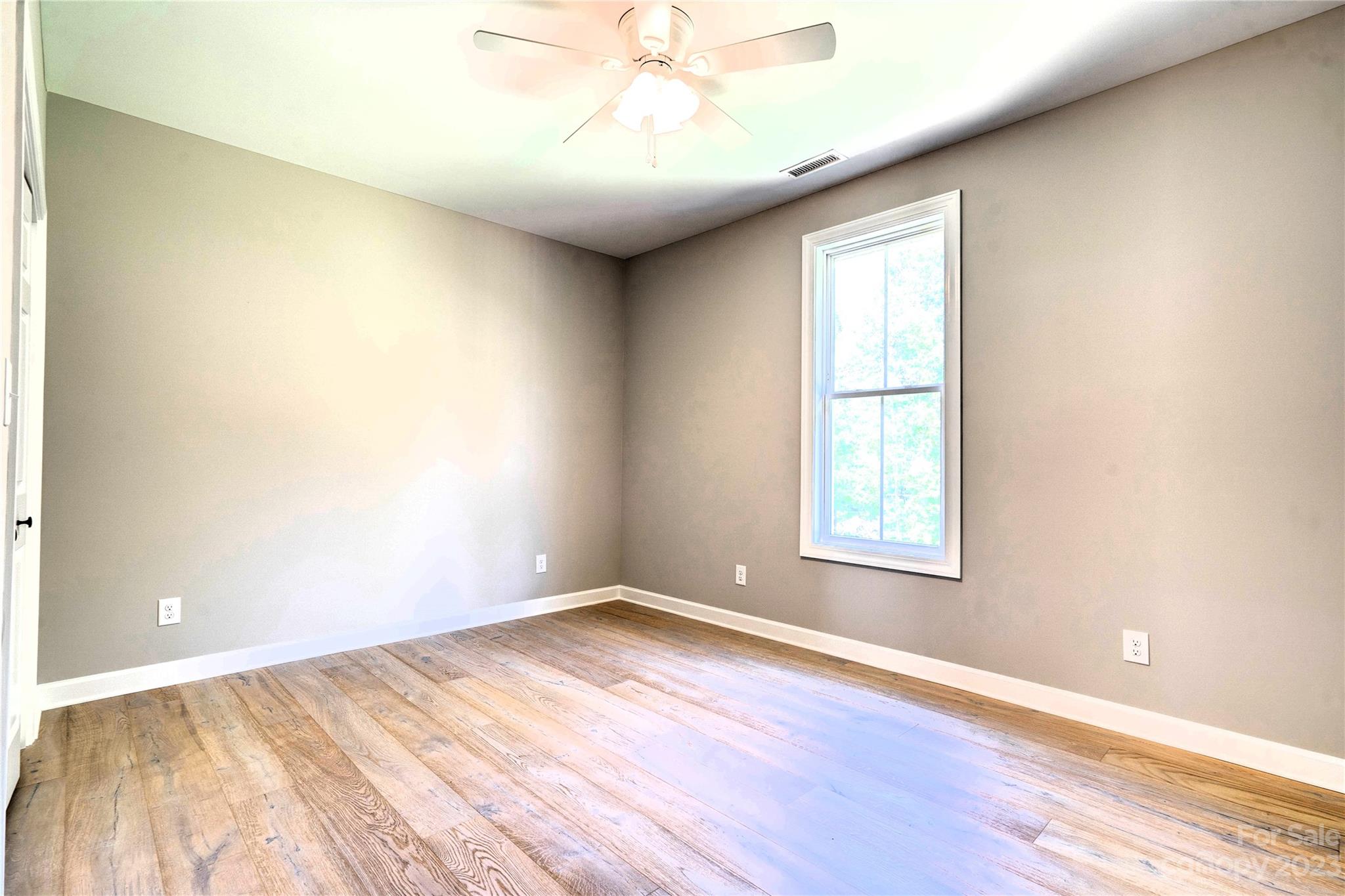 4326 Boulder Drive Morganton, NC 28655 - Photo 28 of 46 an empty room with wooden floor and windows